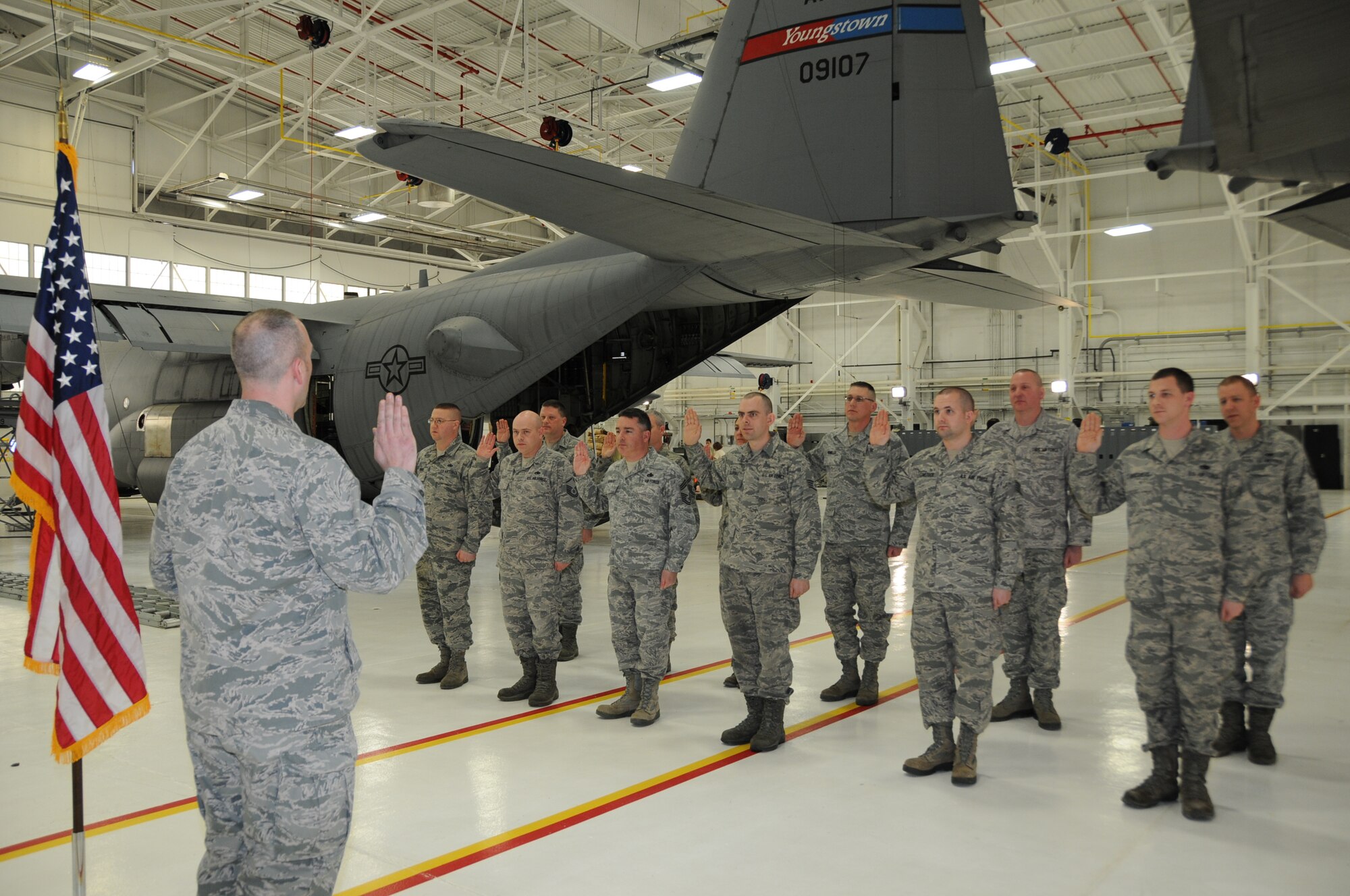 Capt. Donald Singleton, aircraft maintenance officer with the 910th Aircraft Maintenance Squadron, leads Maintenance Group members in the oath of enlistement, March 7, 2015. (U.S. Air Force photo/Tech. Sgt. Rick Lisum)