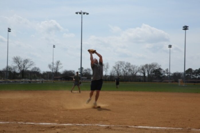 NORFOLK (Apr. 3, 2015) - Major Jeremy Demott, the Exercise Support Officer with U.S. Marine Forces Command, catches a pop-fly during the Navy-Marine Corps Relief Society softball game April 3 at Captain Slade Cutter Park, Norfolk, Virginia. Marines participated in a softball fundraiser for the NMCRS. Each year, fundraising for the NMCRS, happens during March. This year, the deadline was extended until April 10. (U.S. Marine Corps photo by Lance Cpl. Logan Snyder/ RELEASED)