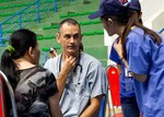 In this file photo, U.S. Army Maj. Matthew Pfipsen, Bravo Company family physician, Tripler Army Medical Center, Honolulu, Hawaii, asks a Vietnamese translator to interpret a question during a Operation Pacific Angel 15-3 health servic outreach event at Dung Quat Culture - Sports Center, Quang Ngai Province, Vietnam, March 23, 2015. Pfipsen is deployed with more than 45 U.S. Army, Marines, Navy and Air Force to Vietnam to provide general health care and engineering repair to help strengthen host nation and U.S. relations. 