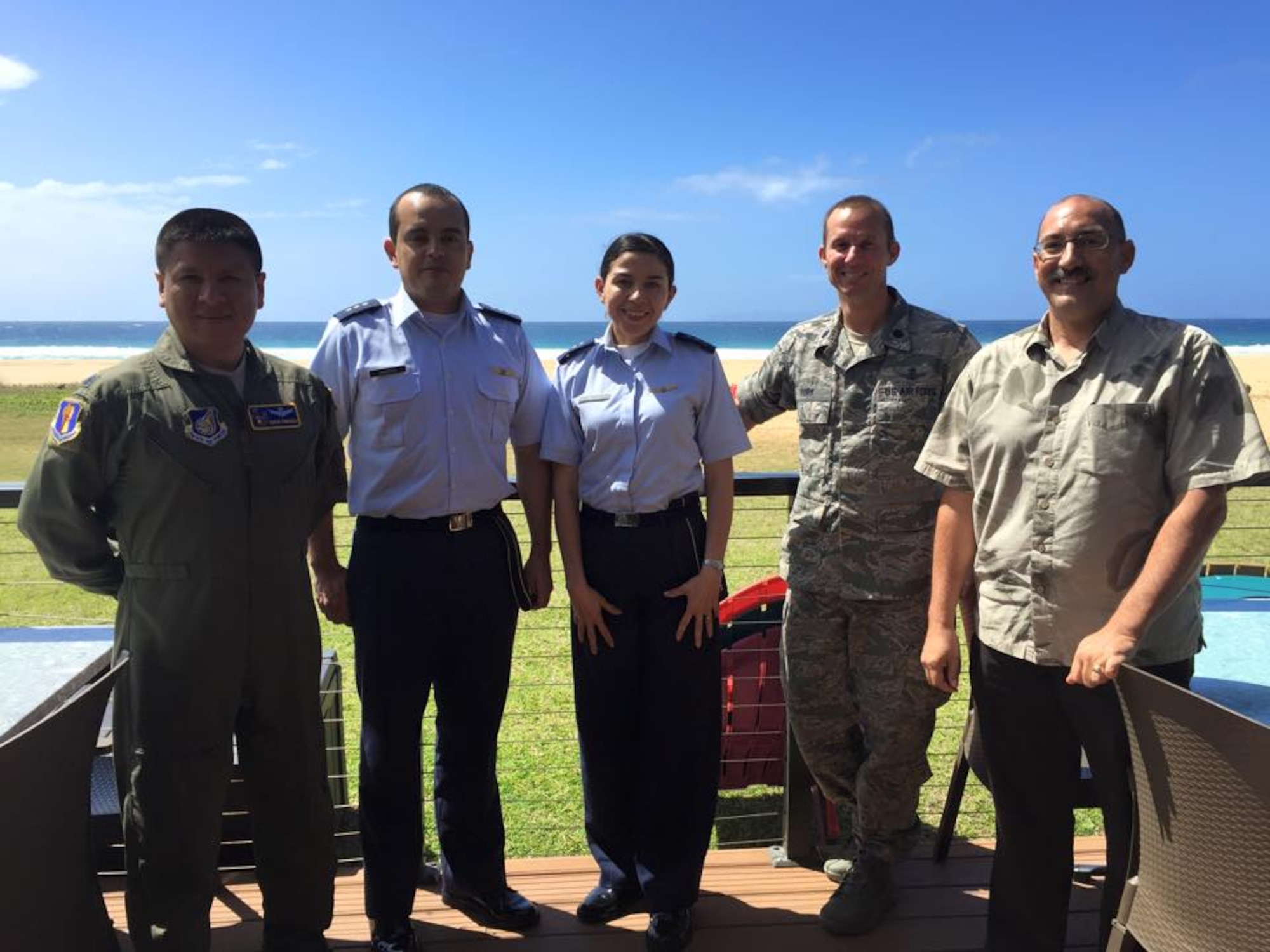 (From left) U.S. Air Force Lt. Col. Erick Fonseca, Colombian air force Capitans Fabio Sandoval and Andrea Correchea, Lt. Col. Trae York and XXXXXXXXX from the whatever, pose for a photo near the beach in Hawaii during the Colombian space familiarization trip in February. (Courtesy photo) 