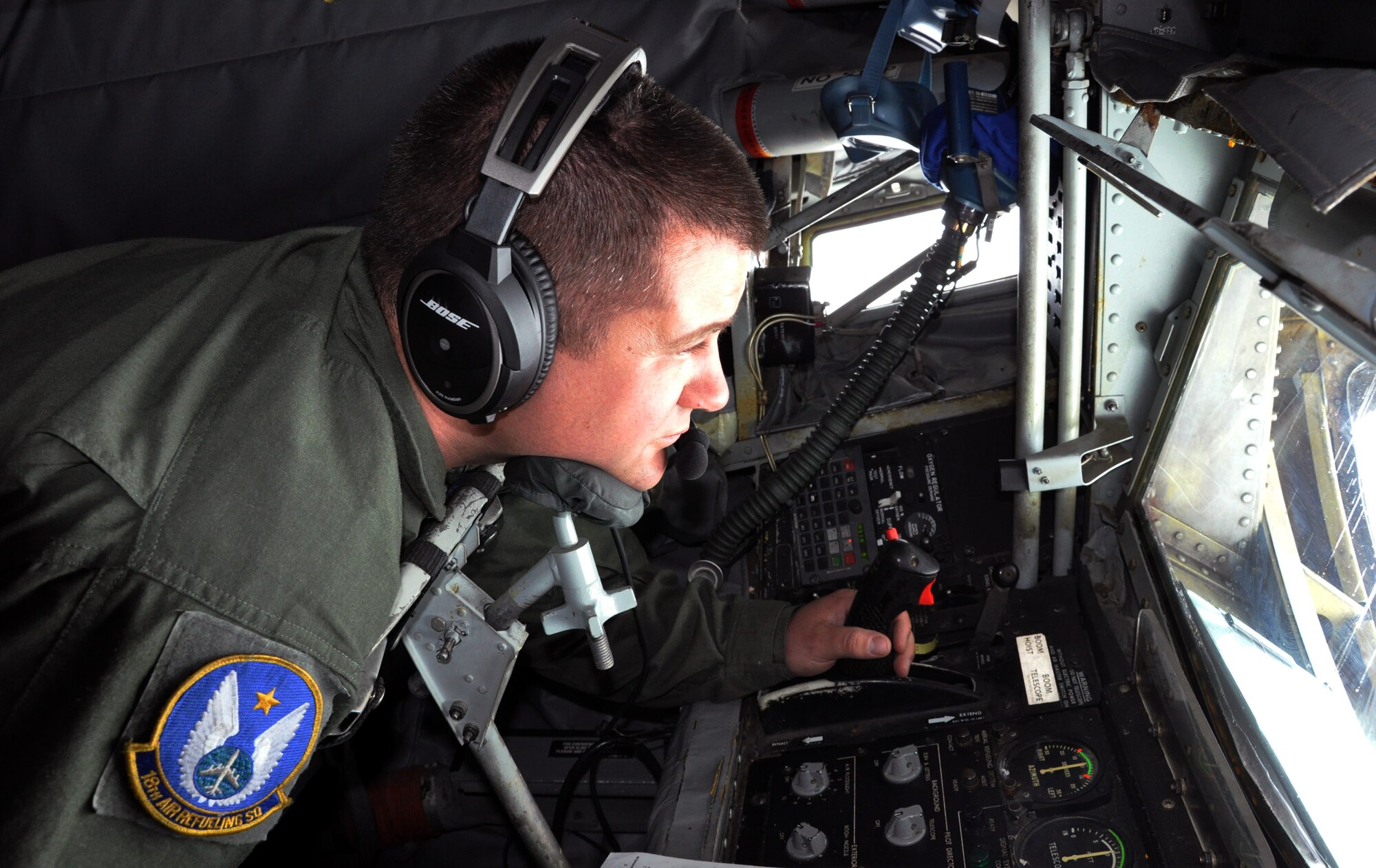 Master Sgt. Aaron Meadows, an air refueling boom operator assigned to the Air Force Reserve 18th Air Refueling Squadron, 931st Air Refueling Group, McConnell Air Force Base, Kan., peers through the window of the refueling boom pod of a KC-135 Stratotanker while performing an aerial refueling of a B-52 Stratofortress from the AF Reserve 307th Bomb Wing, Barksdale AFB, La., April 8, 2015. The two reserve units routinely perform air refueling exercises together in order to meet training requirements and maintain aircrew proficiency. (U.S. Air Force photo by Capt. Zach Anderson)