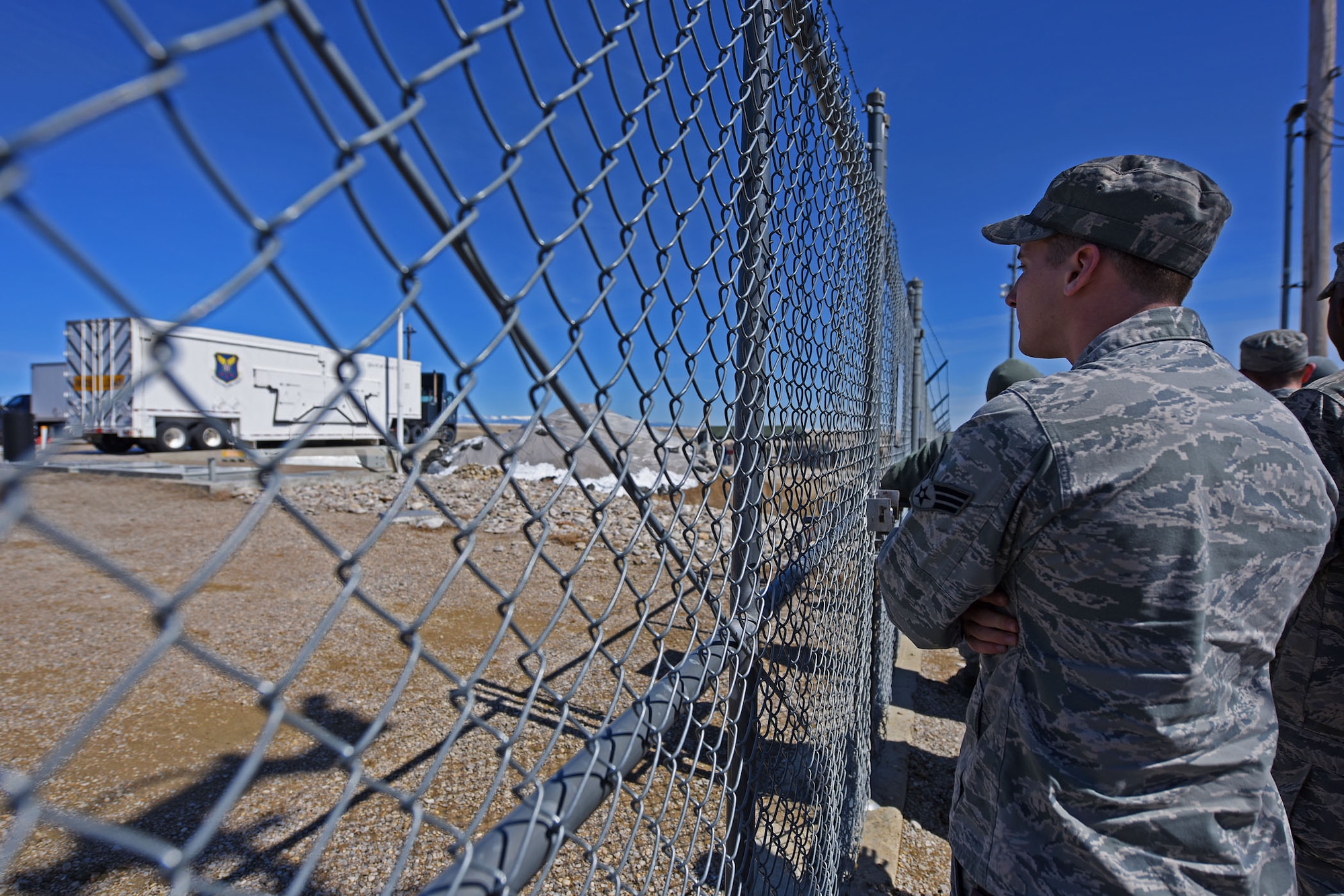 A Team Malmstrom member watches with anticipation as a 100-ton launcher closure door slides open during the installation’s Simulated Electronic Launch-Minuteman test at a launch facility April 7. During the test, Airmen form Malmstrom, along with test personnel from the 576th Flight Test Squadron at Vandenberg AFB, California, worked together to perform a successful SELM. (U.S. Air Force/Airman 1st Class Collin Schmidt)