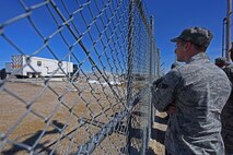 A Team Malmstrom member watches with anticipation as a 100-ton launcher closure door slides open during the installation’s Simulated Electronic Launch-Minuteman test at a launch facility April 7. During the test, Airmen form Malmstrom, along with test personnel from the 576th Flight Test Squadron at Vandenberg AFB, California, worked together to perform a successful SELM. (U.S. Air Force/Airman 1st Class Collin Schmidt)