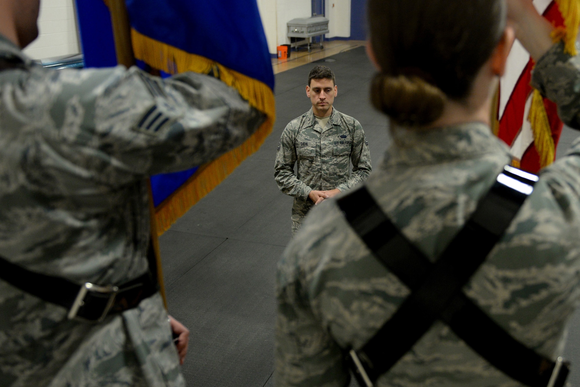 Tech. Sgt. Thomas Diehl, Scott Air Force Base Honor Guard NCOIC, evaluates the new Honor Guard Airmen during a colors ceremony practice April 3, 2015, at Scott Air Force Base, Ill. Diehl believes that becoming a great ceremonial guardsman boils down to three qualities: patience, respect, and perfectionism. (U.S. Air Force photo/Airman 1st Class Kiana Brothers)