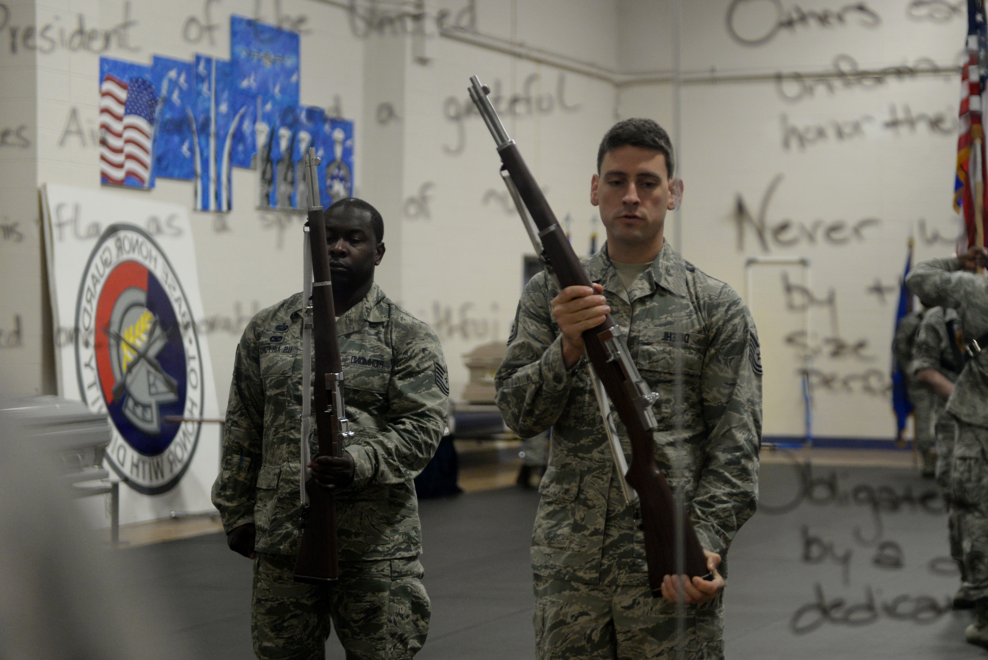 Tech. Sgt. Thomas Diehl, Scott Air Force Base Honor Guard NCOIC, teaches new Honor Guard Airmen how to properly perform the steps of the firing party formation April 3, 2015, at Scott Air Force Base, Ill. Diehl directed $307,000 of funds within the program, trained and tracked daily operations of four flights making up 273 members, and saved the Air Force $272,000 through a budget audit (U.S. Air Force photo/Airman 1st Class Kiana Brothers)