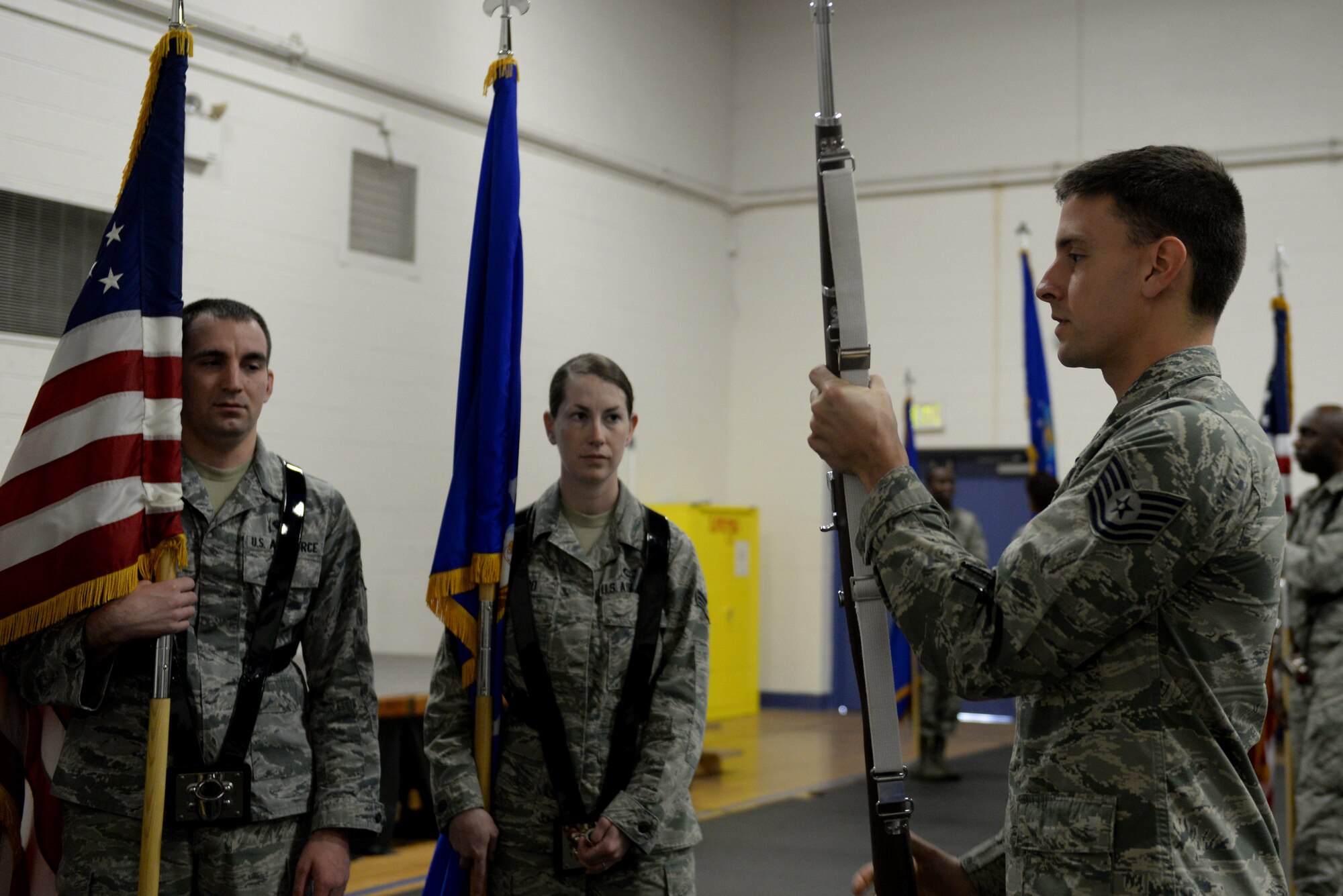 Tech. Sgt. Thomas Diehl, Scott Air Force Base Honor Guard NCOIC, teaches new Honor Guard Airmen how to properly perform rifles portion of the colors formation April 3, 2015, at Scott Air Force Base, Ill. During his time leading the largest Honor Guard in AMC, Diehl and his team dignified 2,311 fallen veterans, three of which being active duty,  over 110,000 miles spanning six states. (U.S. Air Force photo/Airman 1st Class Kiana Brothers)