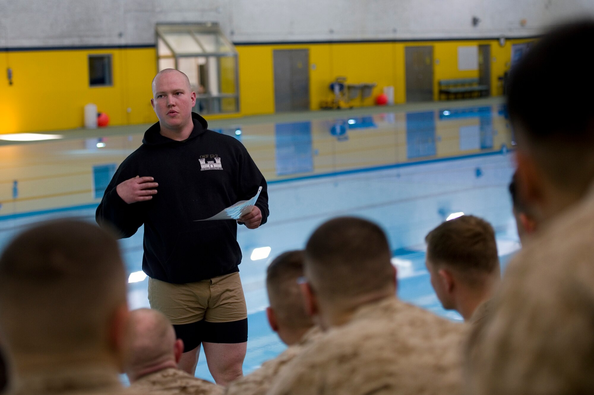 U.S. Marine Corps Sgt. Peter Richards, Engineer Service Company, Combat Logistics Battalion, 4th Marine Logistics Group instructor of water survival, teaches swim techniques to a group of Marines from Detachment 1, Communication Company, Combat Logistics Regiment 45, 4th Marine Logistics Group, during their water survival training at Great Lakes Naval Station, Ill., March 21, 2015. During training approximately 90 Marines completed basic qualification with a 100 percent pass rate, and another 25 volunteers went on to complete intermediate qualification.