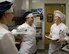 U.S. Air Force Staff Sgt. Amanda Riemenschneider, right,  133rd Force Support Squadron, Sustainment Services Flight, speech to Airman 1st Class  Taylor Kolu and Senior Airman Mariah Klingenberg  in St. Paul, Minn., March 21, 2015. Riemenschneider ‘s Sustainment Services Flight is one of three Air National Guard units that are being evaluated for the Senior Master Sgt. Kenneth W. Disney Food Service Excellence.
(U.S. National Guard photo by Tech. Sgt. Amy M. Lovgren/ Released)

