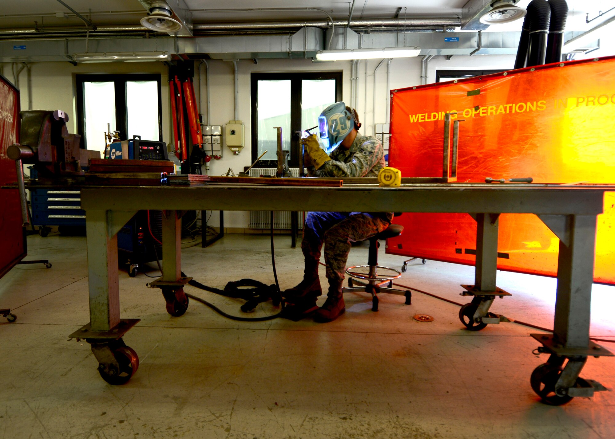 U.S. Air Force Airman 1st Class Jordan Barfield, 31st Maintenance Squadron aircraft metals technology journeyman, uses Tungsten Inert Gas to weld a nitrogen cart booster stand, April 8, 2015, at Aviano Air Base, Italy. Metals technology Airmen design, weld and fabricate machine precision tools, components and assemblies for aerospace weapon systems and other support equipment. (U.S. Air Force photo by Senior Airman Areca T. Wilson/Released)