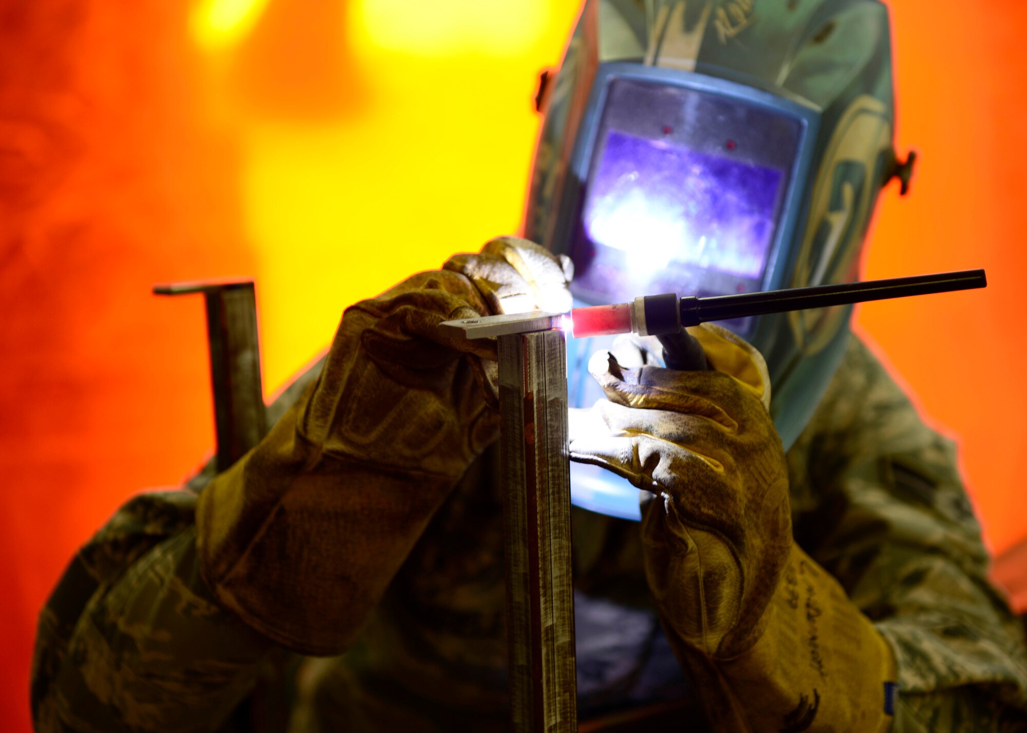U.S. Air Force Airman 1st Class Jordan Barfield, 31st Maintenance Squadron aircraft metals technology journeyman, uses Tungsten Inert Gas to weld a nitrogen cart booster stand, April 8, 2015, at Aviano Air Base, Italy. The unit’s primary mission is to support F-16 Fighting Falcons and transient aircraft. (U.S. Air Force photo by Senior Airman Areca T. Wilson/Released)