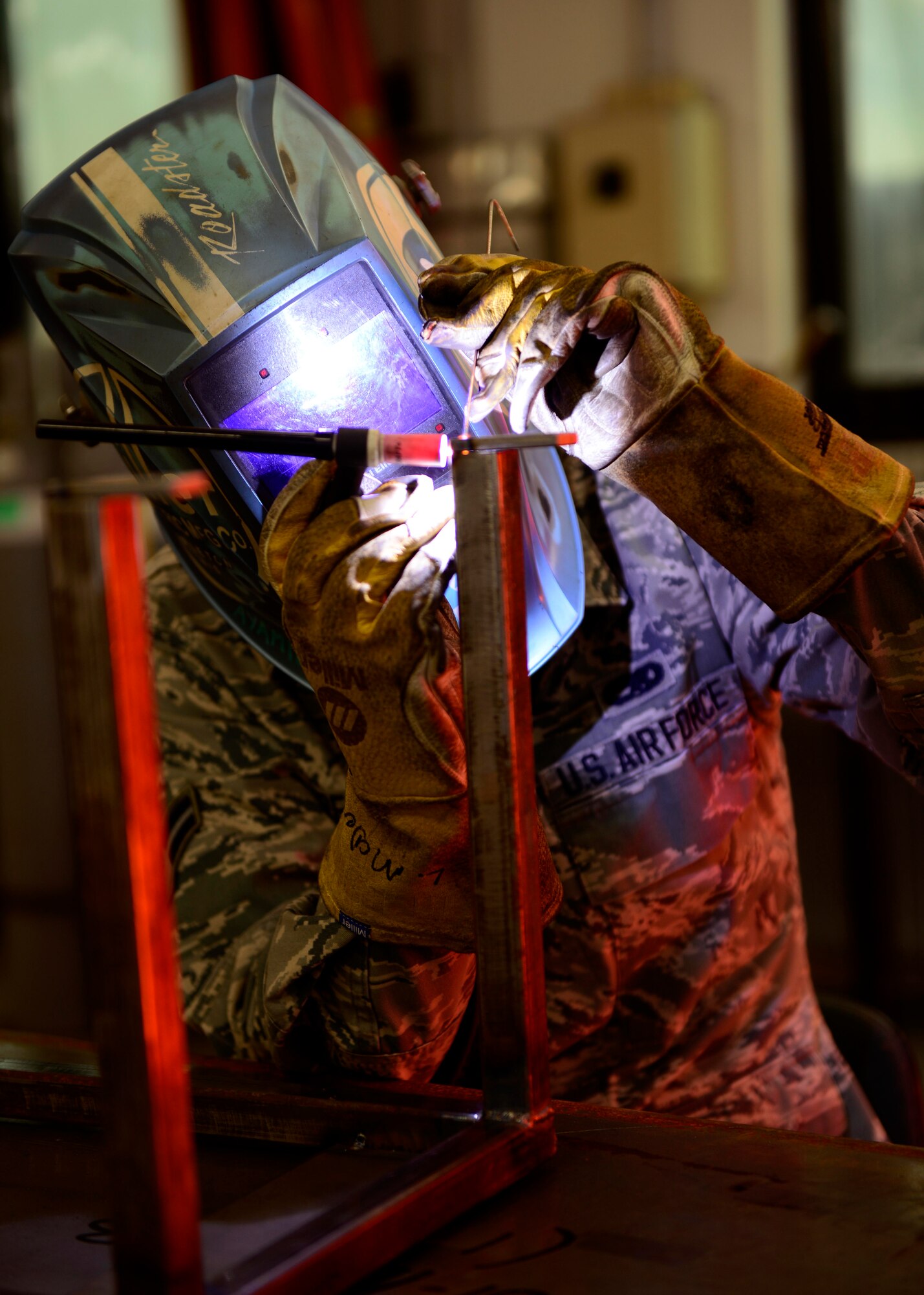 U.S. Air Force Airman 1st Class Jordan Barfield, 31st Maintenance Squadron aircraft metals technology journeyman, uses Tungsten Inert Gas to weld a nitrogen cart booster stand, April 8, 2015 at Aviano Air Base, Italy. Airmen with the 31st Maintenance Squadron aircraft metals technology flight are responsible for fabricating and fixing Fighting Falcon F-16 aircraft parts. (U.S. Air Force photo by Senior Airman Areca T. Wilson/Released)