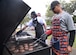 Master Sgt. Leslie Finley, 81st Training Wing Staff Agency first sergeant, and other members of the Keesler First Sergeant Council grill hamburgers and hot dogs at the 2015 Child Pride Day, April 4, 2015, at marina park, Keesler Air Force Base, Miss. More than 600 children and parents from Keesler attended the event that featured activities, demonstrations and information on programs focused on care of military families. (U.S. Air Force photo by Senior Airman Holly Mansfield)