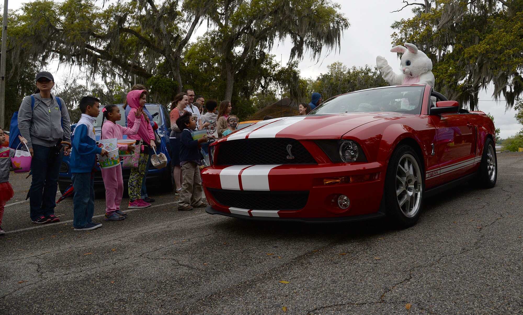 An Easter parade kicks off the 2015 Child Pride Day, April 4, 2015, at marina park, Keesler Air Force Base, Miss. More than 600 children and parents from Keesler attended the event that featured activities, demonstrations and information on programs focused on care of military families. (U.S. Air Force photo by Senior Airman Holly Mansfield)