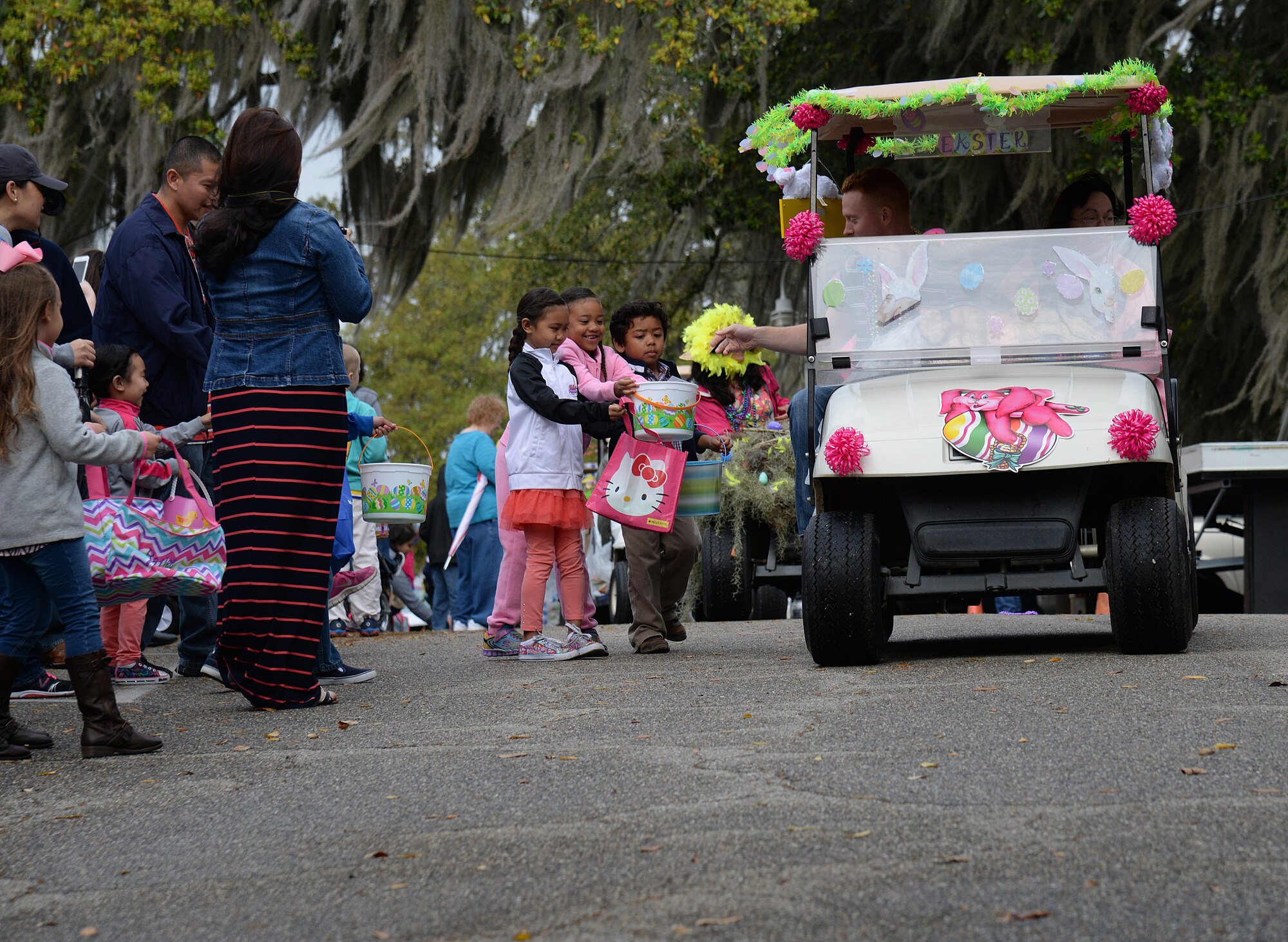 An Easter parade kicks off the 2015 Child Pride Day, April 4, 2015, at marina park, Keesler Air Force Base, Miss. More than 600 children and parents from Keesler attended the event that featured activities, demonstrations and information on programs focused on care of military families. (U.S. Air Force photo by Senior Airman Holly Mansfield)