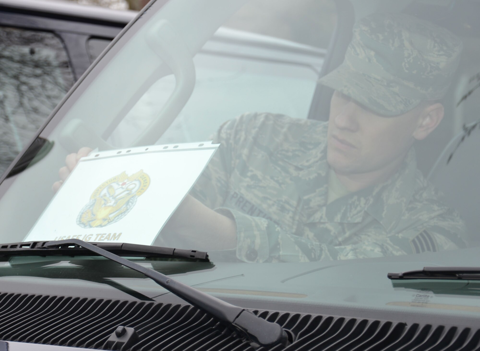 U.S. Air Force Staff Sgt. Jason Prentice, 100th Logistics Readiness Squadron NCO in charge of operators, records and licensing from Portland, Ore., prepares a vehicle for U.S. Air Forces in Europe Inspector General Office inspectors visit, March 19, 2015, on RAF Mildenhall, England. The inspection team visited for a Unit Effectiveness Inspection Capstone Event. (U.S. Air Force photo by Gina Randall/released)