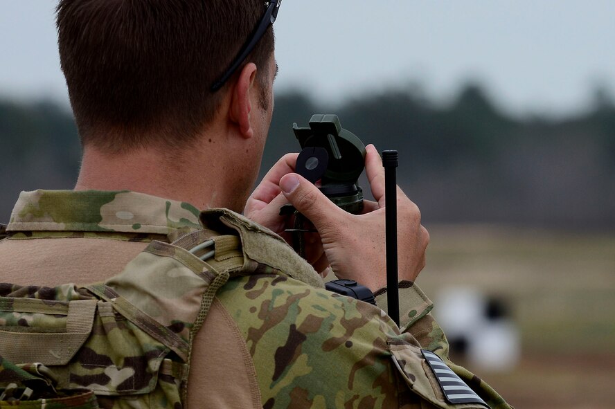 U.S. Air Force Tech Sgt. Matthew Talbot, 25th Air Support Operations Squadron Tactical Air Control Party journeyman from Wheeler Army Air Field, Hawaii, uses a compass during training at Poinsett Electronic Combat Range, Wedgefield, S.C., March 25, 2015. To maximize training, the TACP’s interacted with multiple squadrons and guard units within flying distance of Poinsett Range, including the 55th Fighter Squadron, Army National Guard and Air National Guard. (U.S. Air Force photo by Senior Airman Diana M. Cossaboom/Released)