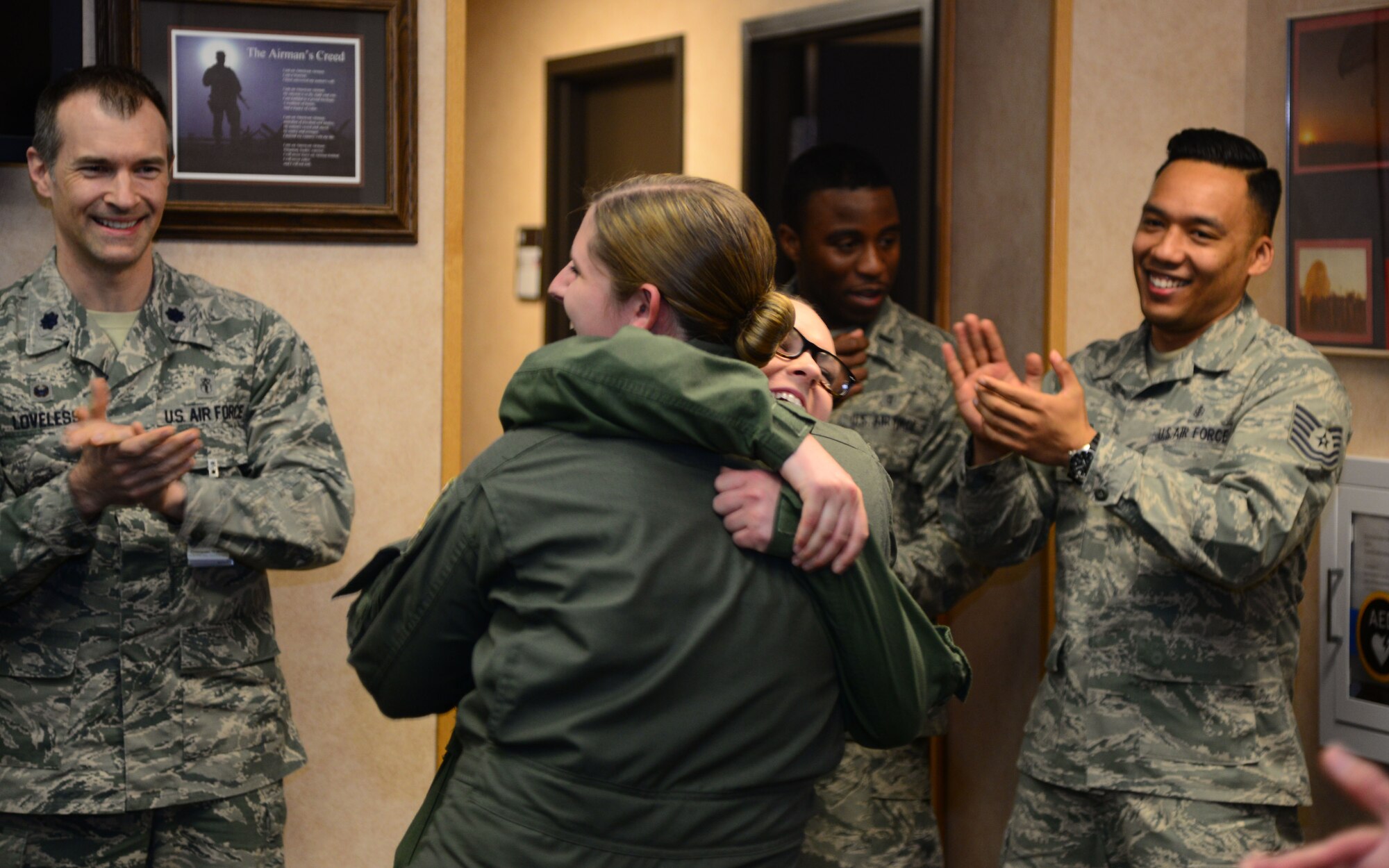 VANCE AIR FORCE BASE, Okla. – Airmen 1st Class Ariel Schlenther, front, and Toni Greka, both 71st Medical Operations Squadron aerospace physiology technicians, hug after finding out they were both selected for below-the-zone promotions. Airmen selected for below-the-zone promotions sew on their senior airman stripes six months early. (U.S. Air Force photo/Senior Airman Frank Casciotta)