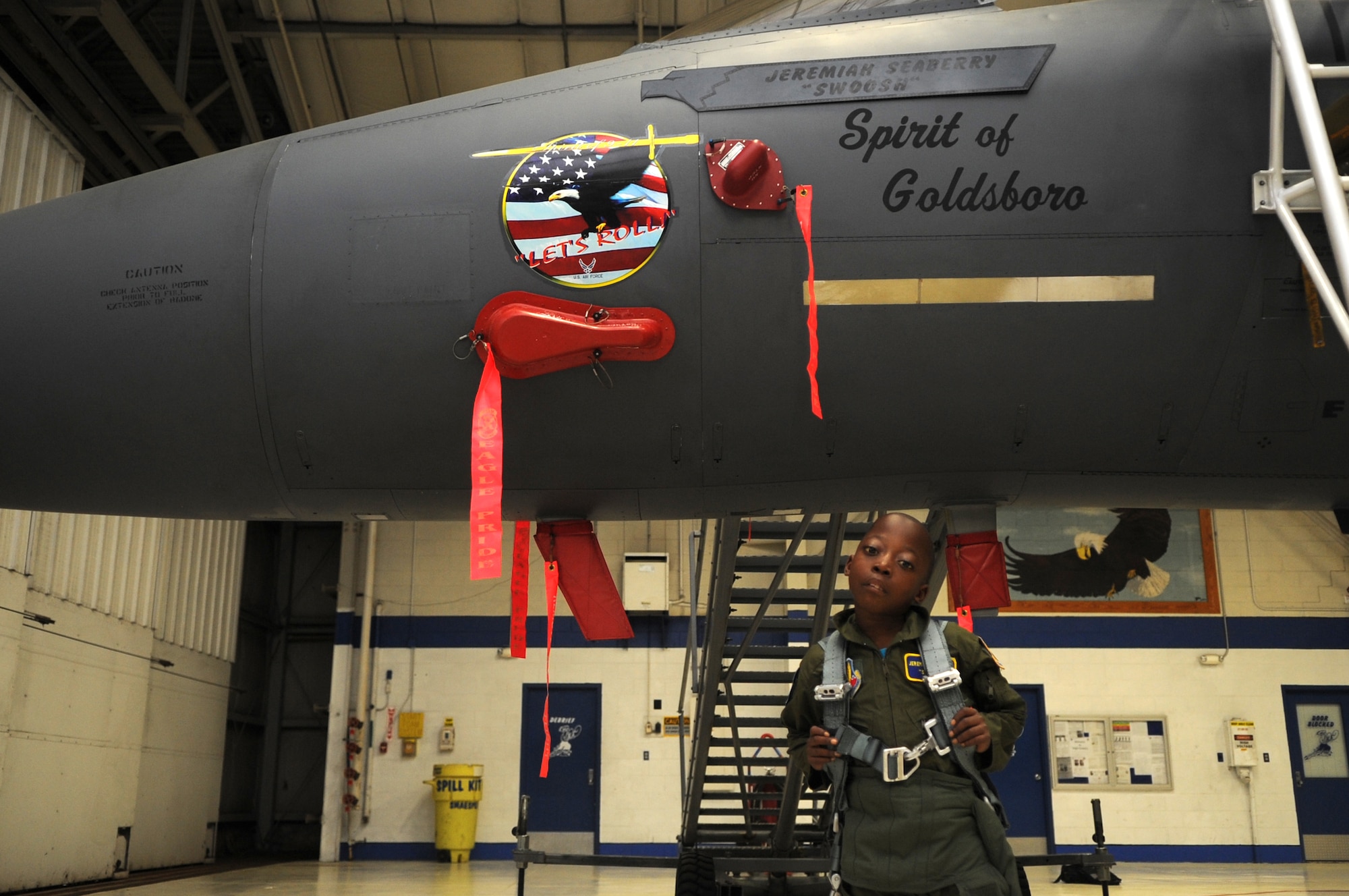 Jeremiah Seaberry, 334th Fighter Squadron pilot for a day, poses in front of “his” F-15E Strike Eagle during a 4th Fighter Wing Pilot for a Day event, April 3, 2015, at Seymour Johnson Air Force Base, North Carolina. Jeremiah’s name and call sign were temporarily placed on the aircraft to mark the special day. (U.S. Air Force photo/Senior Airman Ashley J. Thum)