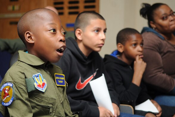 Jeremiah Seaberry, 334th Fighter Squadron pilot for a day, and his family learn about the 334th FS and the F-15E Strike Eagle during a 4th Fighter Wing Pilot for a Day event, April 3, 2015, at Seymour Johnson Air Force Base, North Carolina. Jeremiah was accompanied by his two cousins and his aunt, Melissa, and his grandmother, Portia. (U.S. Air Force photo/Senior Airman Ashley J. Thum)