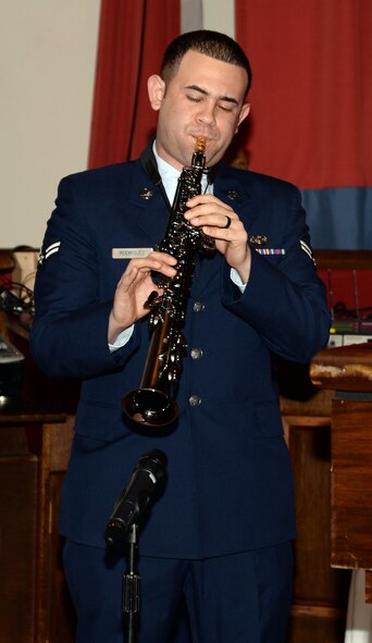 U.S. Air Force Airman 1st Class Javier Rodriguez, 100th Security Forces Squadron response force member from Rochester, N.Y., plays the soprano saxophone before a retirement ceremony Jan. 23, 2015, on RAF Mildenhall, England. Rodriguez auditioned and was selected for the 2015 Tops in Blue cast. (U.S. Air Force photo by Senior Airman Christine Griffiths/Released)