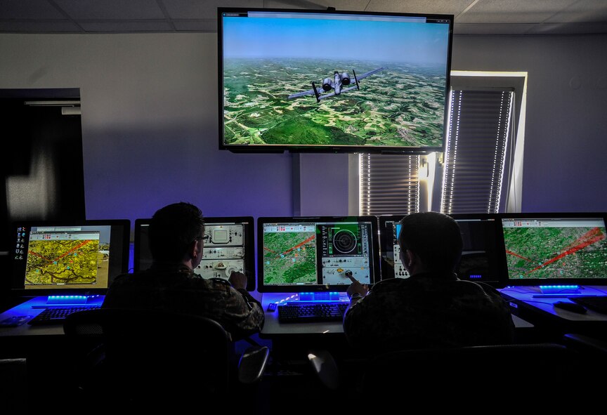 German soldiers direct a simulated surface-to-air attack during a Multinational Aviation Live Virtual Constructive Training System exercise at the Polygone Control Center in Bann, Germany, March 18, 2015. The Polygone Electronic Warfare Range enhanced its training capabilities to provide service members a life-like experience with the use of the PCC. (U.S. Air Force photo/Senior Airman Nicole Sikorski)