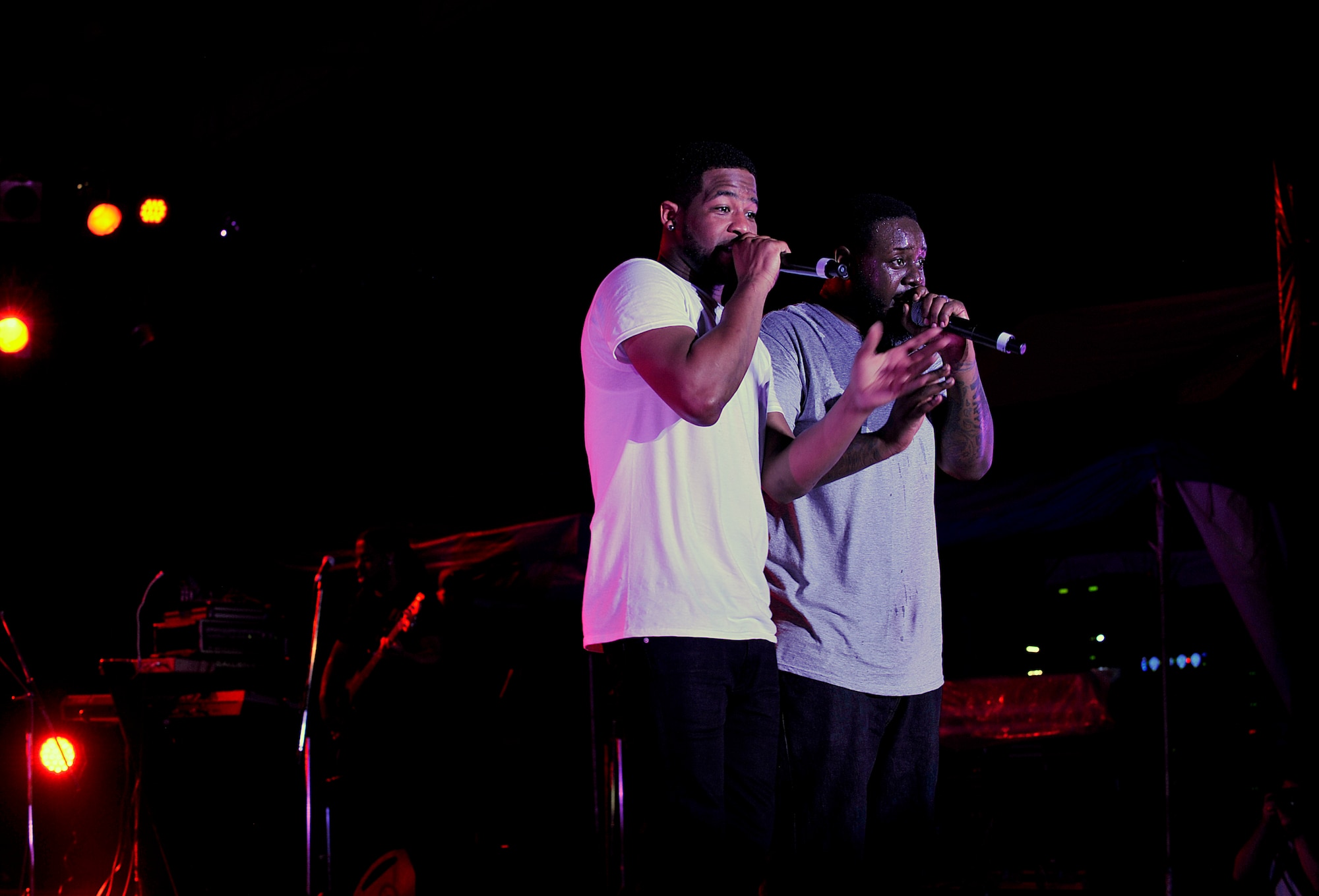 T-Pain, an American singer and rapper, and his partner perform a variety of songs during his concert on Kadena Air Base, Japan, April 6, 2015. T-Pain supported the troops with a performance on Kadena Air Base and Marine Corps Camp Foster in Okinawa, Japan. (U.S. Air Force photo by Naoto Anazawa)