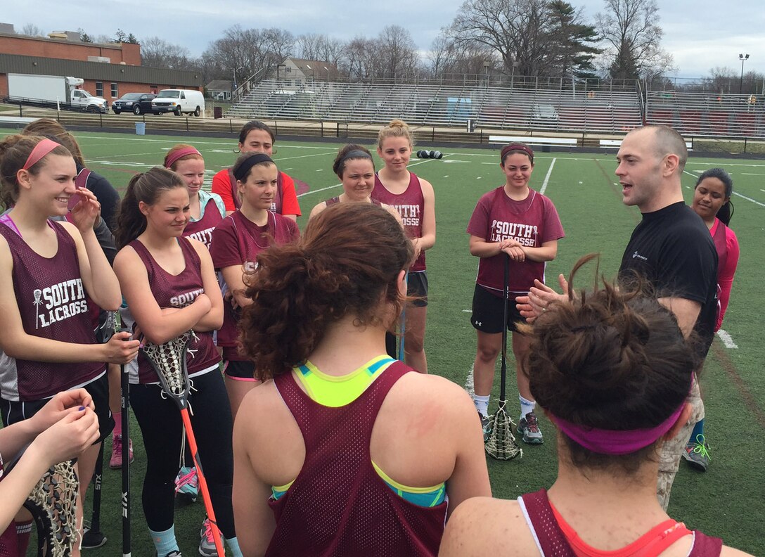 Maj. John F. Campbell, commanding officer of Marine Corps Recruiting Station New Jersey, talks to the Toms River High School South female lacrosse team about the Marine Corps leadership traits and principles during a leadership seminar, April 7, 2015. 