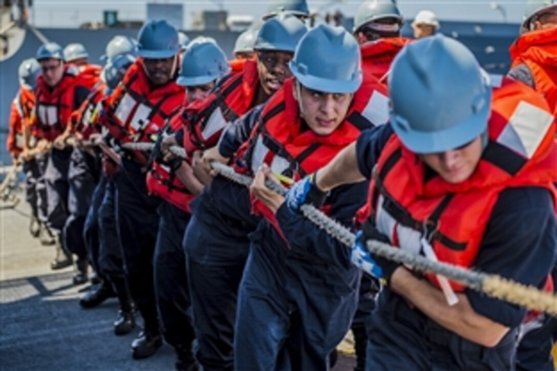 U.S. sailors aboard the guided-missile destroyer USS Fitzgerald heave a line to connect a fuel probe from the Military Sealift Command fleet replenishment oiler USNS Pecos during a replenishment at sea in the South China Sea, April 5, 2015. The Fitzgerald is on patrol in the U.S. 7th Fleet area of responsibility.
