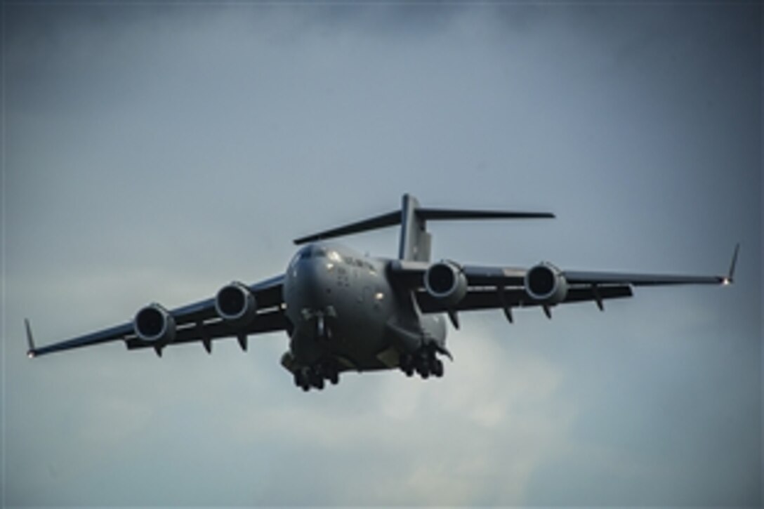 A U.S. Air Force C-17 Globemaster III aircraft prepares to land to deliver equipment for the F-15C Eagle theater security package on Leeuwarden Air Base in the Netherlands in support of Operation Atlantic Resolve, April 1, 2015. The C-17 Globemaster III is assigned to Joint Base Lewis-McChord, Wash.