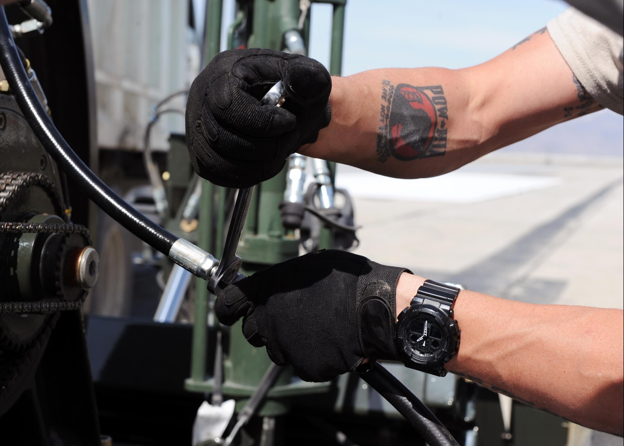 U.S. Air Force Tech. Sgt. Frank Furman, 455th Expeditionary Civil Engineer Squadron NCO-in charge of electrical power production, prepares a Mobile Aircraft Arresting System prior to testing March 18, 2015 at Bagram Airfield, Afghanistan. The MAAS was from a separate taxiway as part of the construction of an alternate runway at Bagram. (U.S. Air Force photo by Staff Sgt. Whitney Amstutz/released)