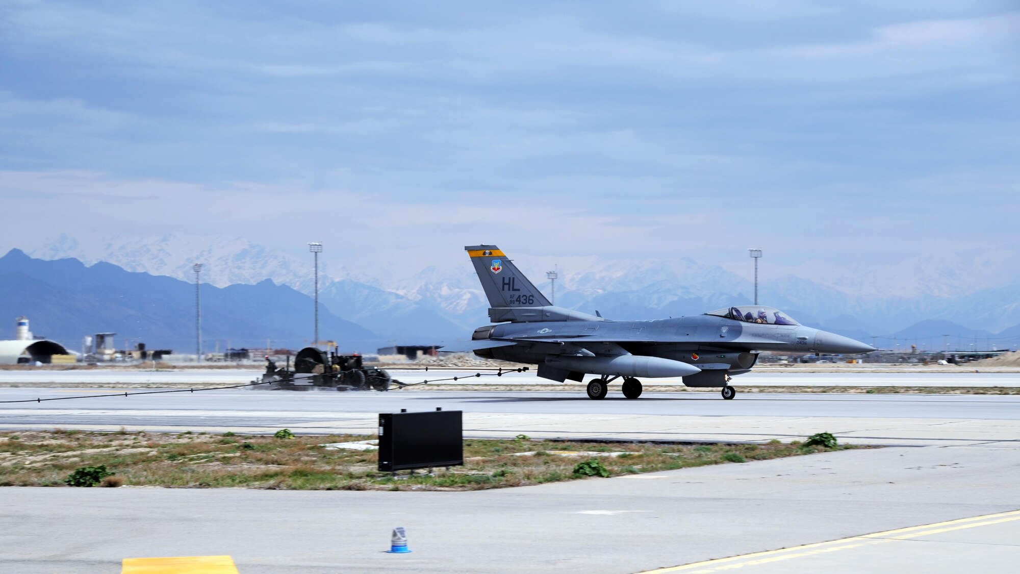 An F-16 Fighting Falcon is caught by the Mobile Aircraft Arresting System during a test of its operational functionality March 20, 2015 at Bagram Airfield, Afghanistan. The MAAS was from a separate taxiway as part of the construction of an alternate runway at Bagram. (U.S. Air Force photo by Master Sgt. James Law/released)