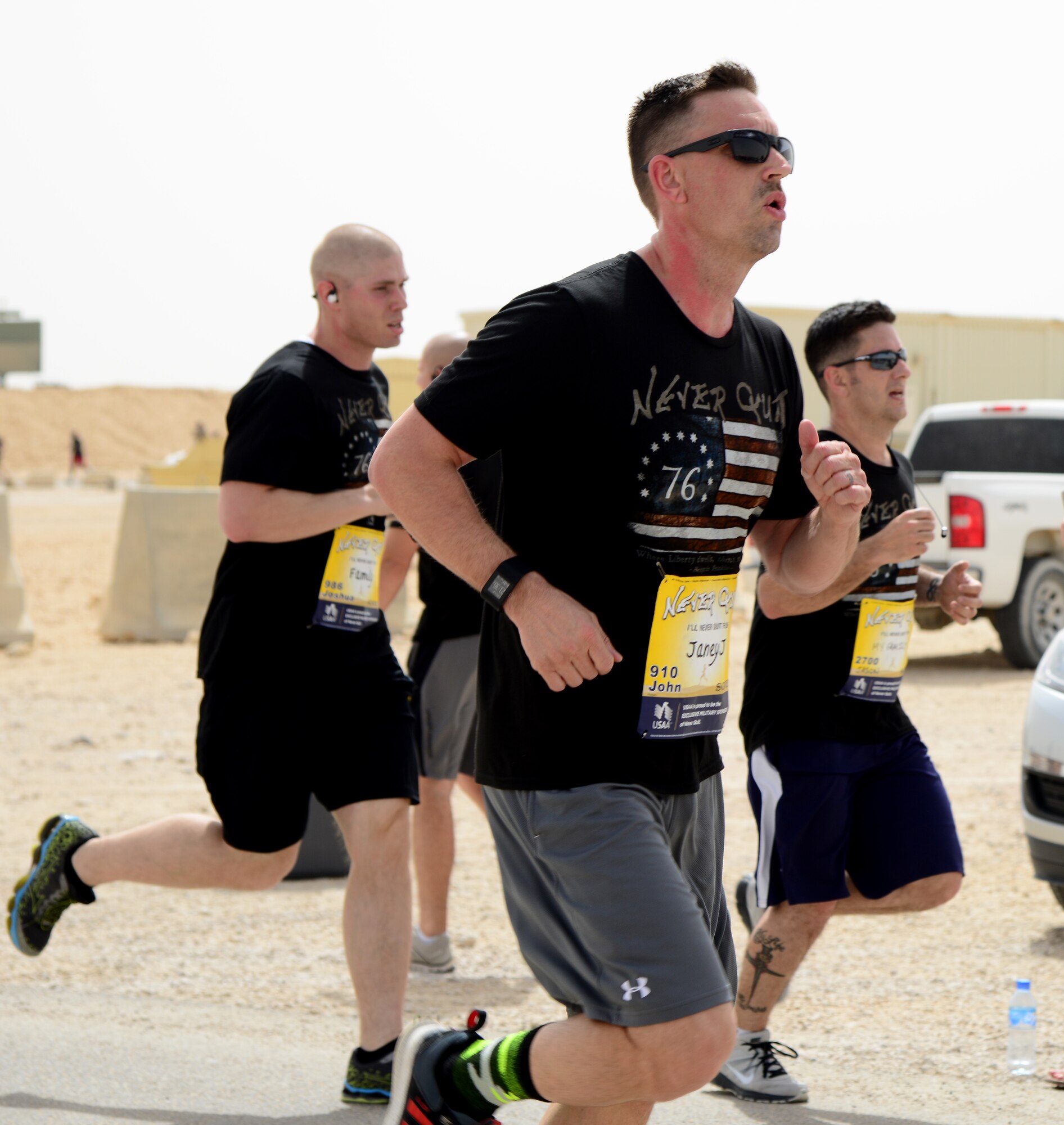 U.S. Air Force Master Sgt. John Reagan, 379th Air Expeditionary Wing safety office, participates in the 379th AEW’s Never Quit event 5k run, April 4, 2015, at Al Udeid Air Base, Qatar. The event was coordinated by the 379th Expeditionary Force Support Squadron with informational booths provided by the 379th Expeditionary Medical Group, 379th Expeditionary Civil Engineer Squadron, and 379th AEW chapel services team. The purpose of the event was to encourage healthy and positive life choices. (U.S. Air Force photo by Senior Airman Kia Atkins)