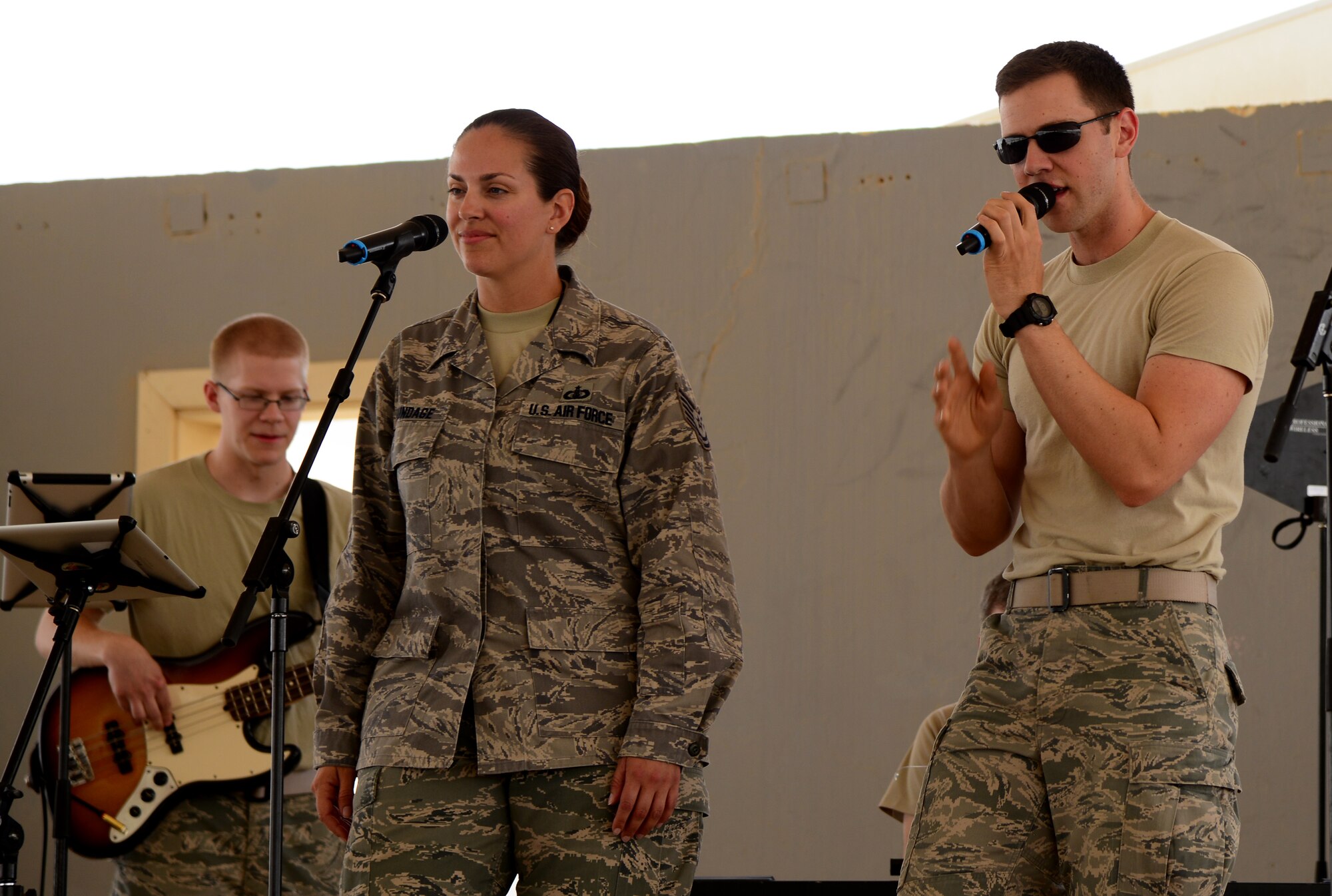 U.S. Air Force Airmen from the Air Force’s Central Band perform during the 379th Air Expeditionary Wing’s Never Quit event, April 4, 2015, at Al Udeid Air Base, Qatar. The event was coordinated by the 379th Expeditionary Force Support Squadron with informational booths provided by the 379th Expeditionary Medical Group, 379th Expeditionary Civil Engineer Squadron, and 379th AEW chapel services team. The purpose of the event was to encourage healthy and positive life choices. (U.S. Air Force photo by Senior Airman Kia Atkins)