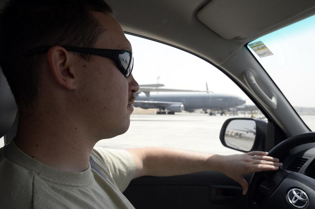 Senior Airman Matthew, airfield management shift lead, patrols the flightline area during a routine inspection at an undisclosed location in Southwest Asia April 1, 2015. The mission of Airfield Management is to coordinate flight plans, prior permission required requests as well as perform airfield checks and inspections. Matthew is currently deployed from McChord Air Force Base, Wash. (U.S. Air Force photo/Tech. Sgt. Marie Brown/RELEASED)