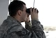 Staff Sgt. Matt, an air traffic control liaison, scans the flightline from the air traffic control tower at an undisclosed location in Southwest Asia, April 3, 2015. The duties of an air traffic controller liaison include making an automated terminal information service, which is a continuous broadcast of recorded weather and any other pertinent information for the pilots that they listen to before they go out. Matt is currently deployed from Tyndall Air Force Base, Fla. (U.S. Air Force photo/Tech. Sgt. Marie Brown)