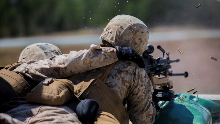 Marines with 2nd Combat Engineer Battalion shoot an M249 Squad Automatic Weapon during a training exercise at range SR-7 aboard Camp Lejeune, N.C., April 6, 2015. Approximately 30 Marines from the battalion conduct a two-day, machine-gun range where they shoot the M249 SAW, the M240 Bravo medium machine gun, and the M2 .50-caliber heavy machine gun from both the mounted and un-mounted positions.
