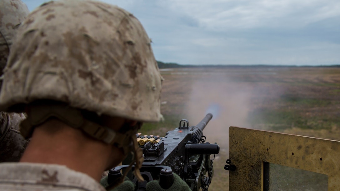 A Marine with 2nd Combat Engineer Battalion shoots the M2 .50-caliber heavy machine gun at targets placed at unknown distances at range SR-7 aboard Camp Lejeune, N.C., April 7, 2015. Approximately 30 Marines from the battalion conducted a two-day, machine-gun range in which they shot the M249 Squad Automatic Weapon, M240 Bravo medium machine gun, and the .50-caliber heavy machine gun from both the mounted and un-mounted positions at targets placed at unknown distances.