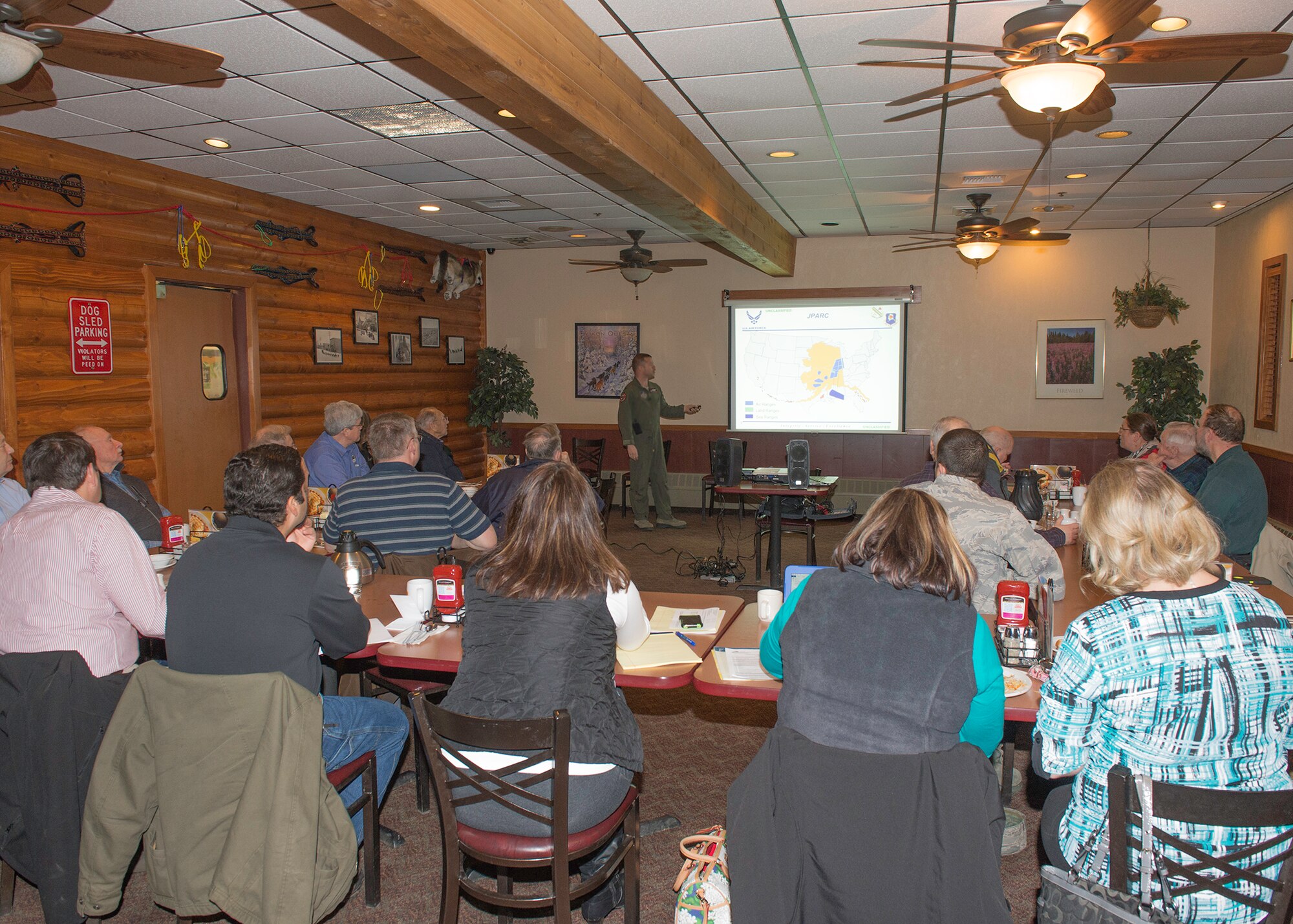 Lt. Col. Dennis Lincoln, the 353rd Combat Training Squadron director of operations, briefs the Greater Fairbanks Chamber of Commerce Transportation Committee at Denny’s in Fairbanks, Alaska, April 9, 2015, about upcoming Joint Pacific Alaska Range Complex changes. Members of the committee offered questions and concerns along with experience being long time aviators who use the JPARC recreationally. (U.S. Air Force photo by Staff Sgt. Shawn Nickel/Released)
