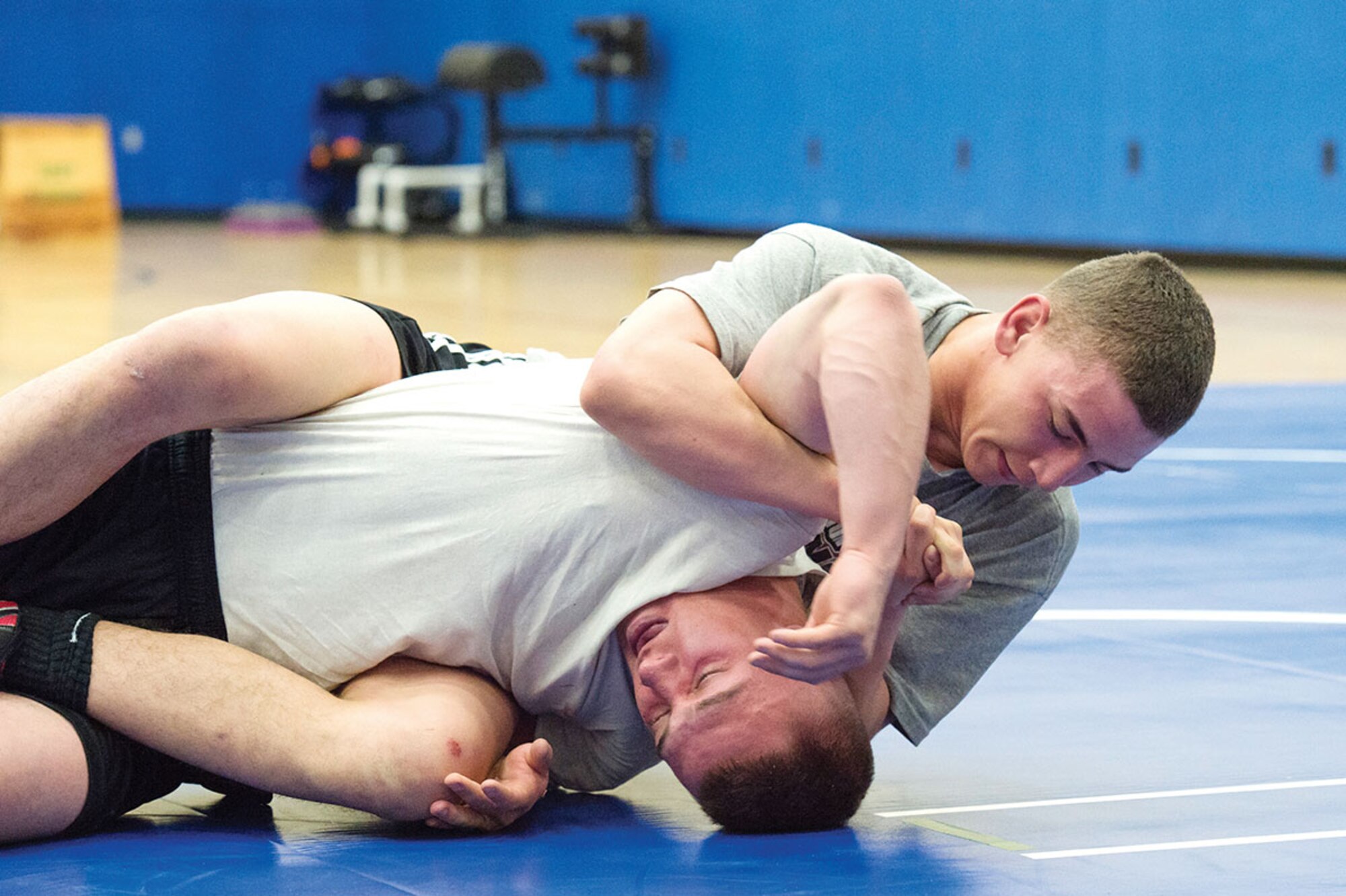 Service members compete in an intramural wrestling tournament on Joint Base Elmendorf-Richardson, Alaska, April 9, 2015. (U.S.Air Force photo/Alejandro Pena)