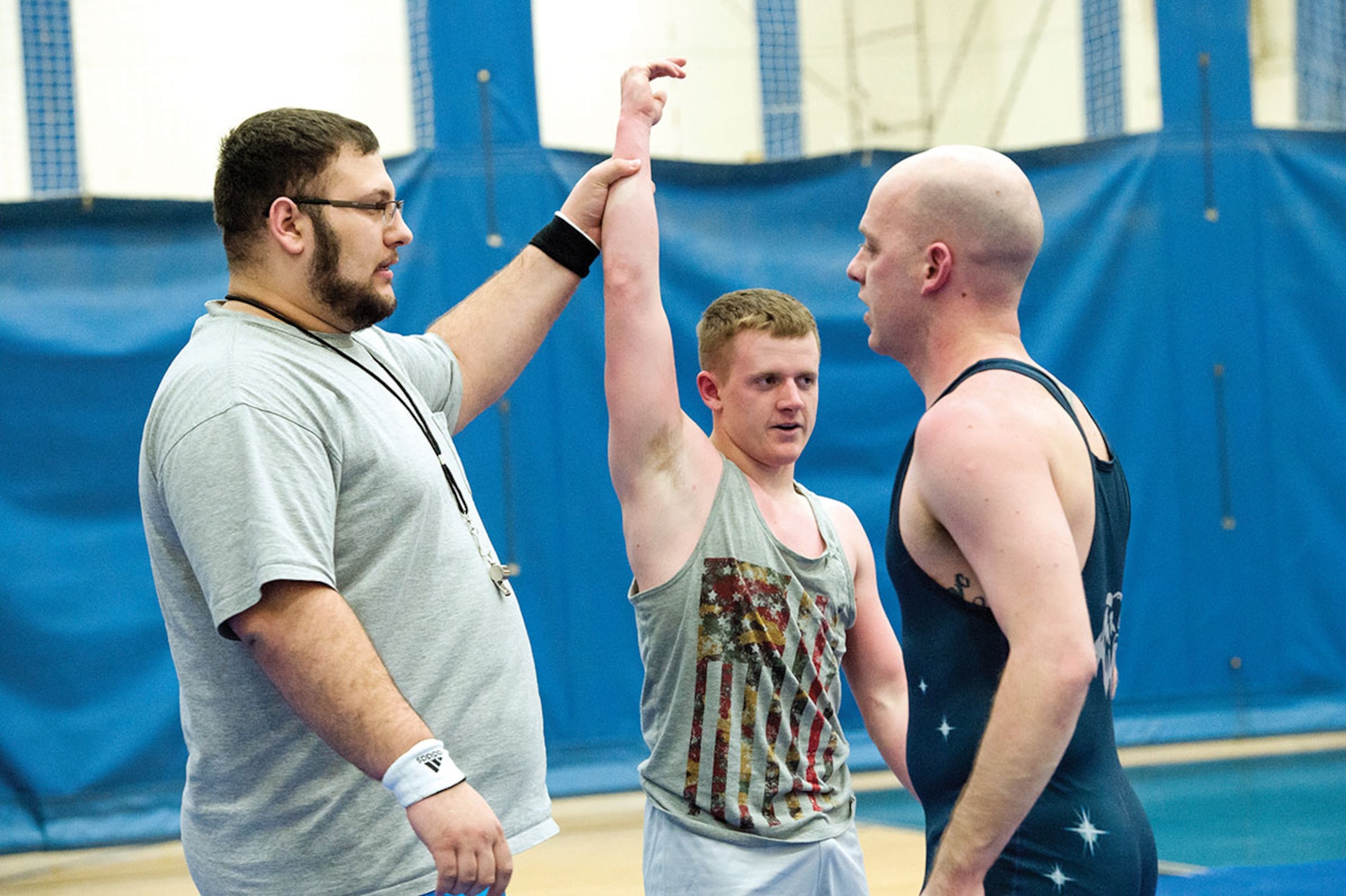 Service members compete in an intramural wrestling tournament on Joint Base Elmendorf-Richardson, Alaska, April 9, 2015. (U.S.Air Force photo/Alejandro Pena)