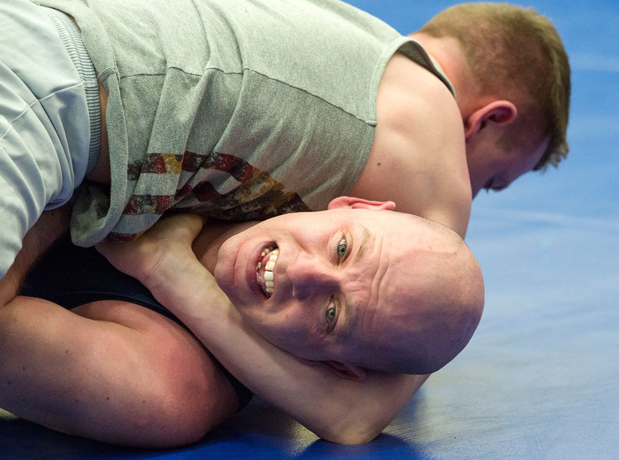 Service members compete in an intramural wrestling tournament on Joint Base Elmendorf-Richardson, Alaska, April 9, 2015. (U.S.Air Force photo/Alejandro Pena)