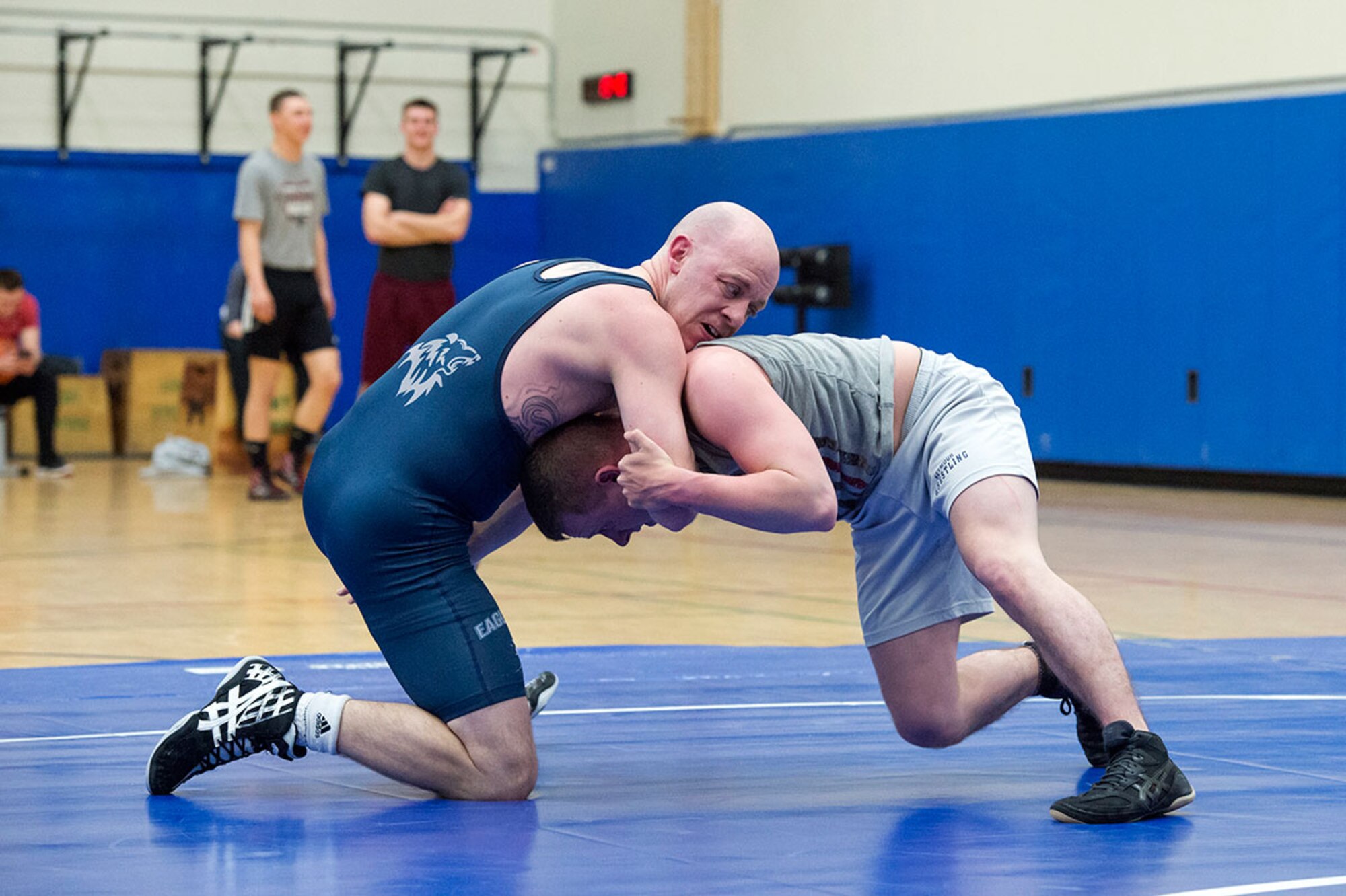 Service members compete in an intramural wrestling tournament on Joint Base Elmendorf-Richardson, Alaska, April 9, 2015. (U.S.Air Force photo/Alejandro Pena)