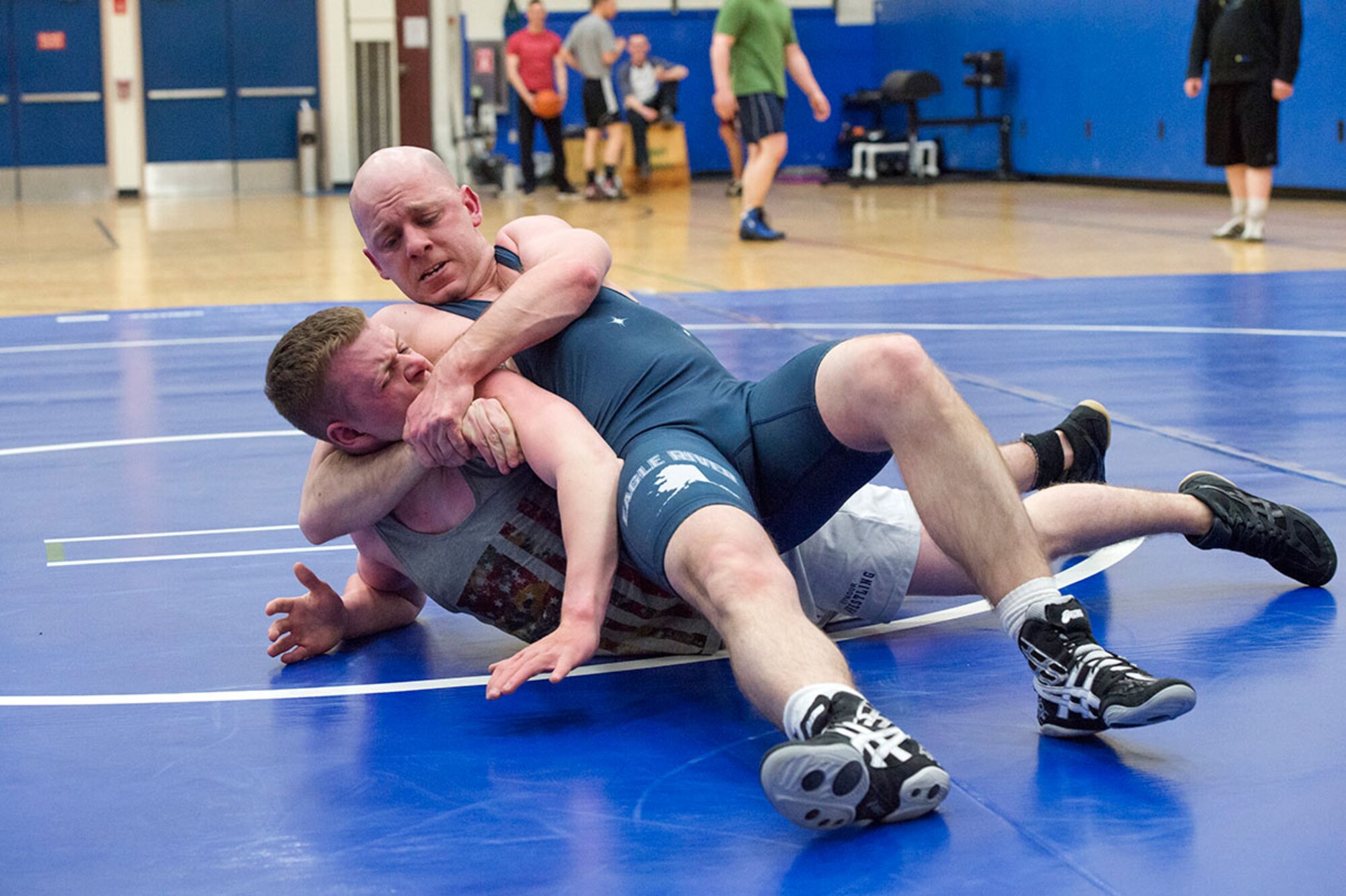 Service members compete in an intramural wrestling tournament on Joint Base Elmendorf-Richardson, Alaska, April 9, 2015. (U.S.Air Force photo/Alejandro Pena)