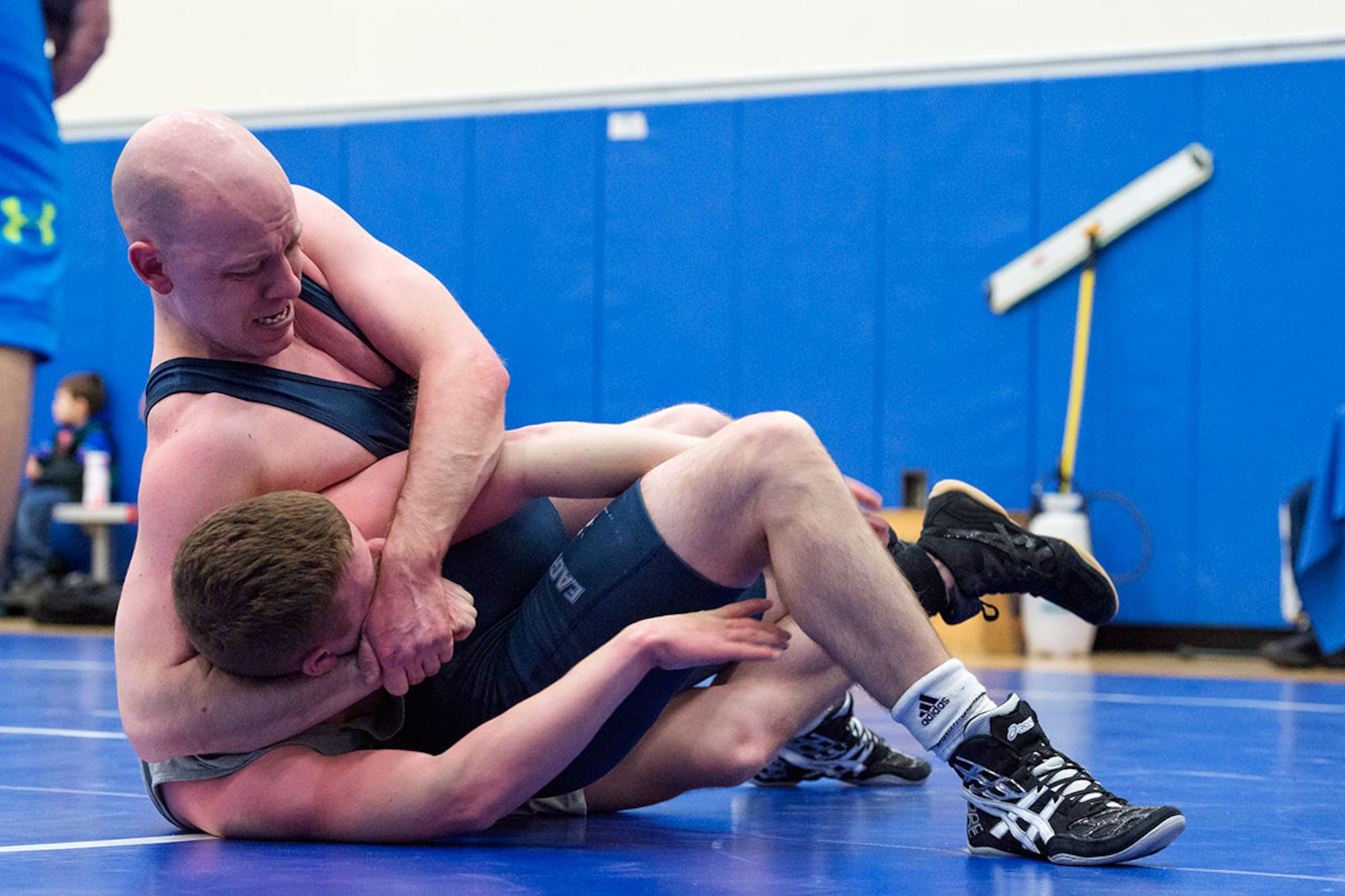 Service members compete in an intramural wrestling tournament on Joint Base Elmendorf-Richardson, Alaska, April 9, 2015. (U.S.Air Force photo/Alejandro Pena)