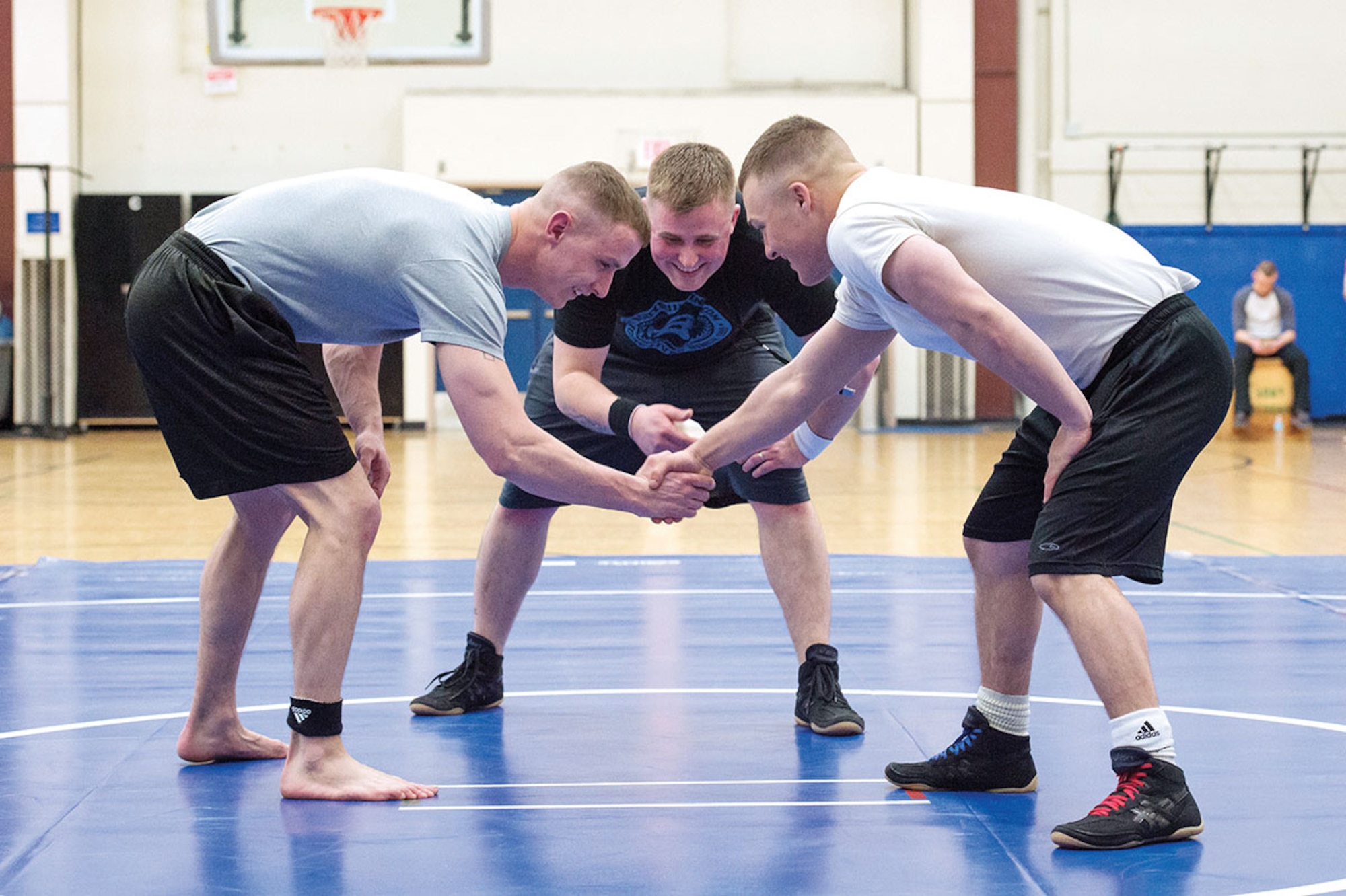 Service members compete in an intramural wrestling tournament on Joint Base Elmendorf-Richardson, Alaska, April 9, 2015. (U.S.Air Force photo/Alejandro Pena)