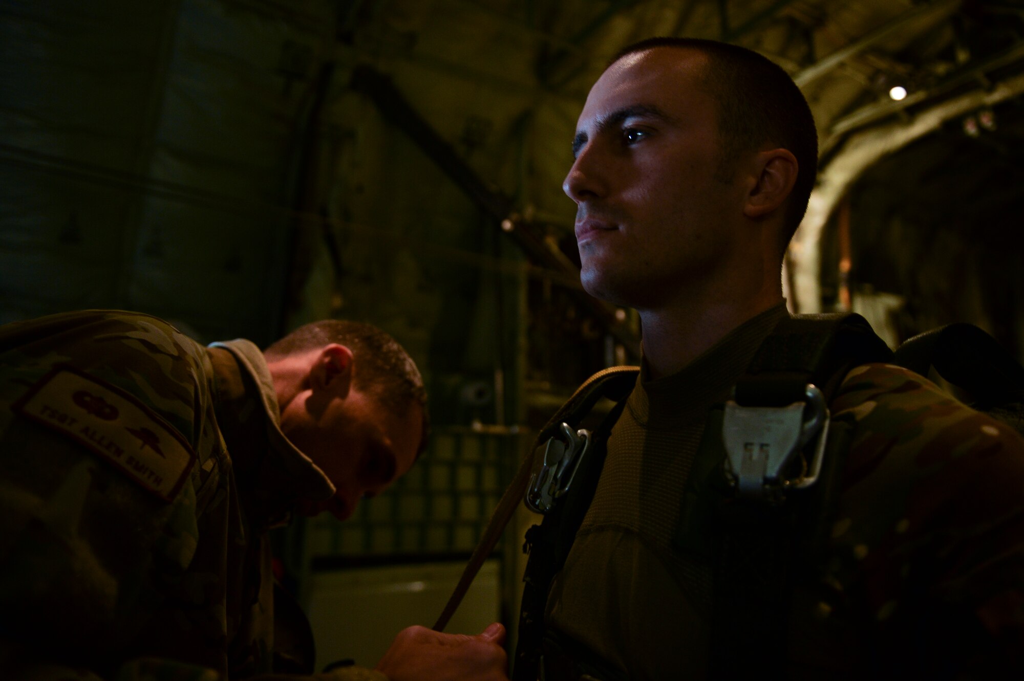Staff Sgt. Joshua Silva, the 19th Aerospace Medical Squadron noncommissioned officer-in-charge of High Altitude Airdrop Mission Support equipment, has his equipment checked before a halo jump March 16, 2015, at Little Rock Air Force Base, Ark. Silva coordinated local high altitude jump operations leading to proficiency training for seven jumpers, four students, and 37 aircrew from three squadrons. (U.S. Air Force photo by Tech. Sgt. Russ Scalf)