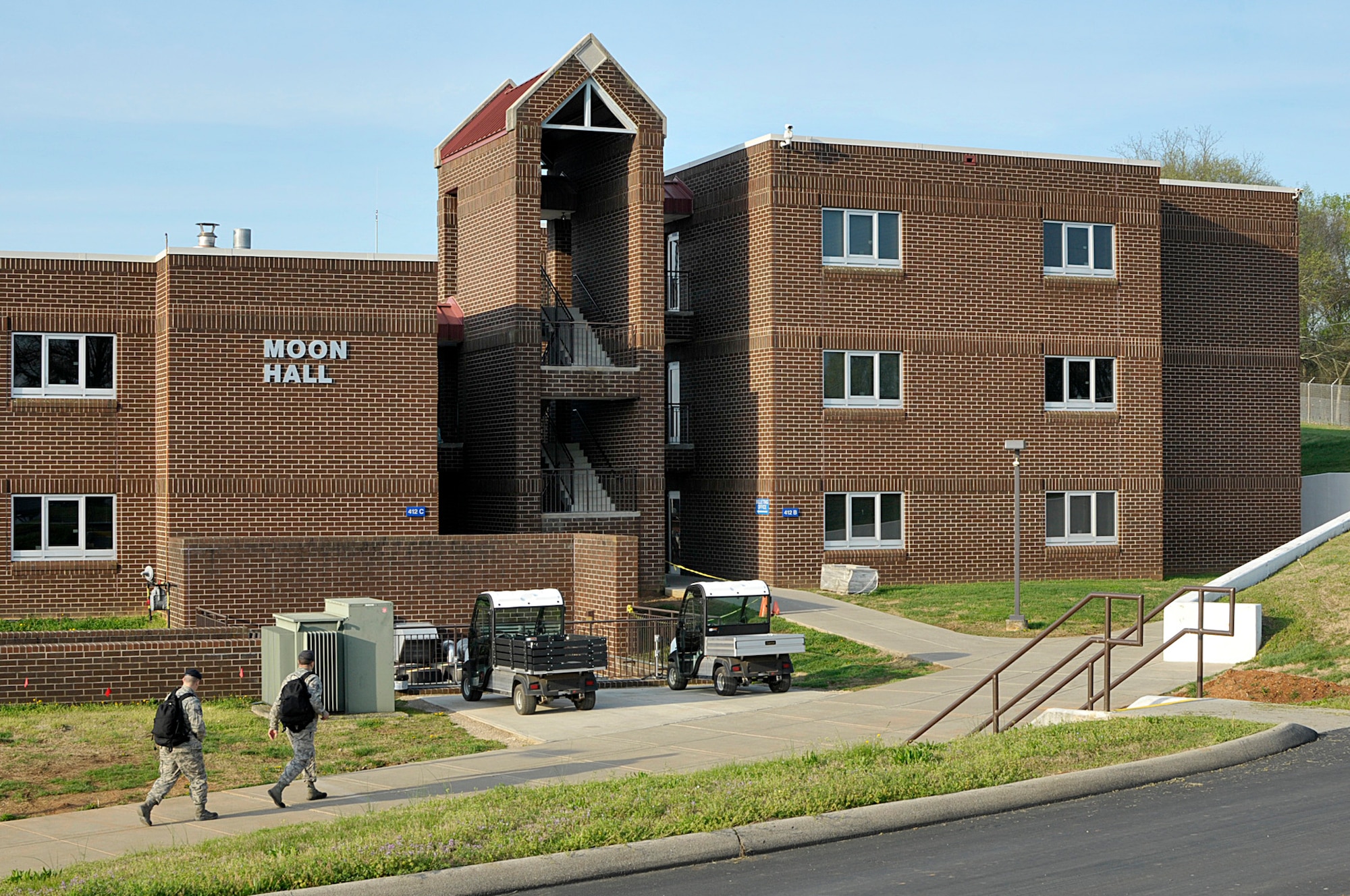 MCGHEE TYSON AIR NATIONAL GUARD BASE, Tenn. - Airmen walk toward the Billeting Office entrance here April 9, 2015 at the I.G. Brown Training and Education Center's Moon Hall, which is named in honor of Chief Master Sgt. Richard Moon, who was the fifth senior enlisted advisor to the Director of the Air National Guard. (U.S. Air National Guard photo by Master Sgt. Mike R. Smith/Released)