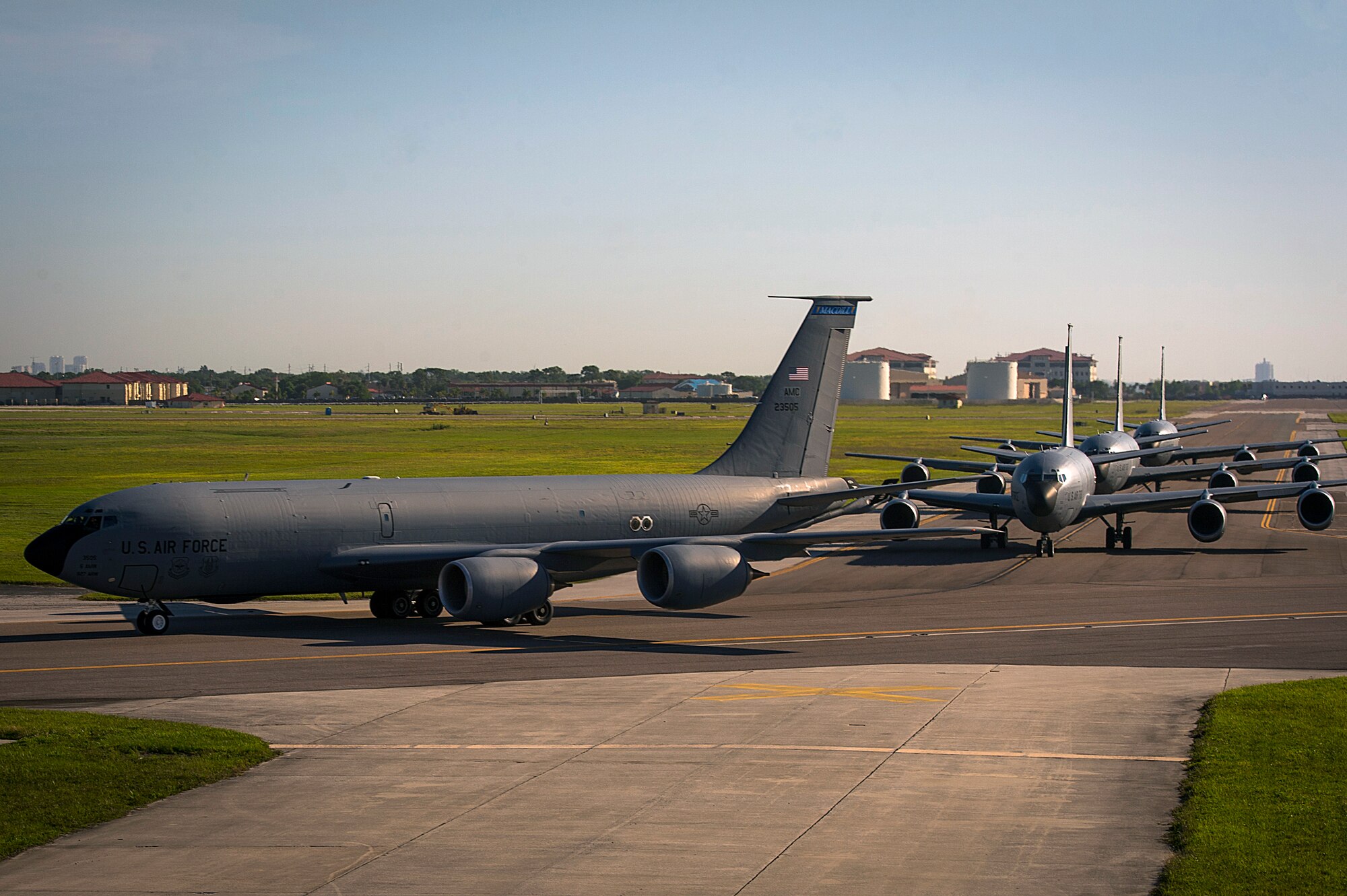 Four KC-135 Stratotankers taxi onto the runway at MacDill Air Force Base, Fla., April 9, 2015. The primary mission of the KC-135 is aerial refueling, but it is also capable of transporting litter and ambulatory patients using patient support pallets during aeromedical evacuations. (U.S. Air Force photo by Senior Airman Ned T. Johnston/Released)