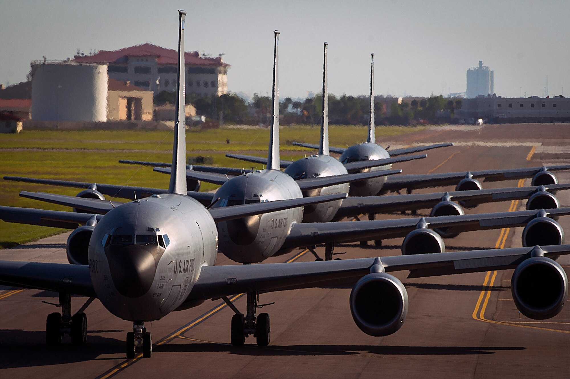 Four KC-135 Stratotankers taxi onto the runway at MacDill Air Force Base, Fla., April 9, 2015. The primary mission of the KC-135 is aerial refueling, but it is also capable of transporting litter and ambulatory patients using patient support pallets during aeromedical evacuations. (U.S. Air Force photo by Senior Airman Ned T. Johnston/Released)