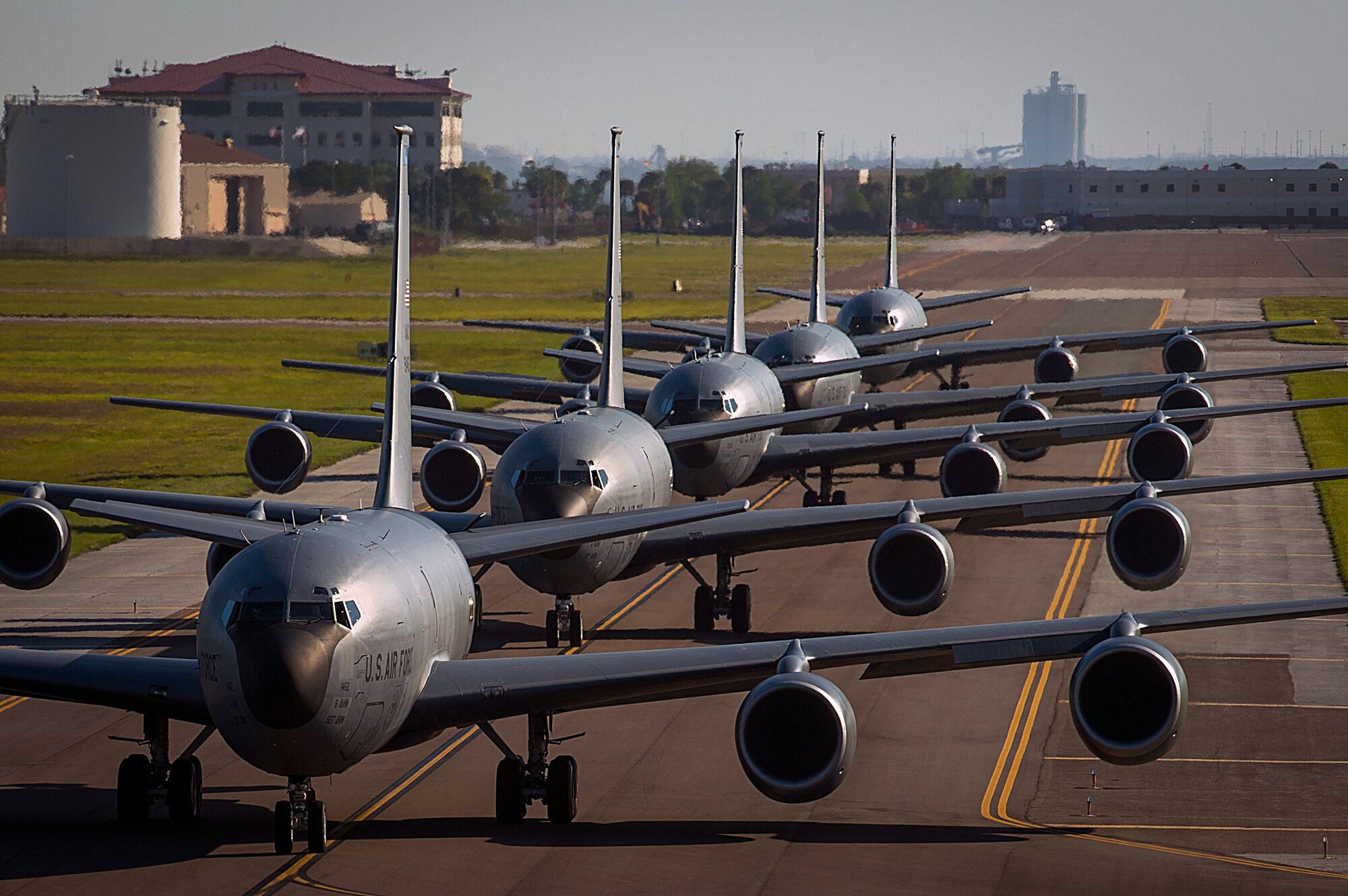 Five KC-135 Stratotankers taxi onto the runway at MacDill Air Force Base, Fla., April 9, 2015. The primary mission of the KC-135 is aerial refueling, but it is also capable of transporting litter and ambulatory patients using patient support pallets during aeromedical evacuations. (U.S. Air Force photo by Senior Airman Ned T. Johnston/Released)